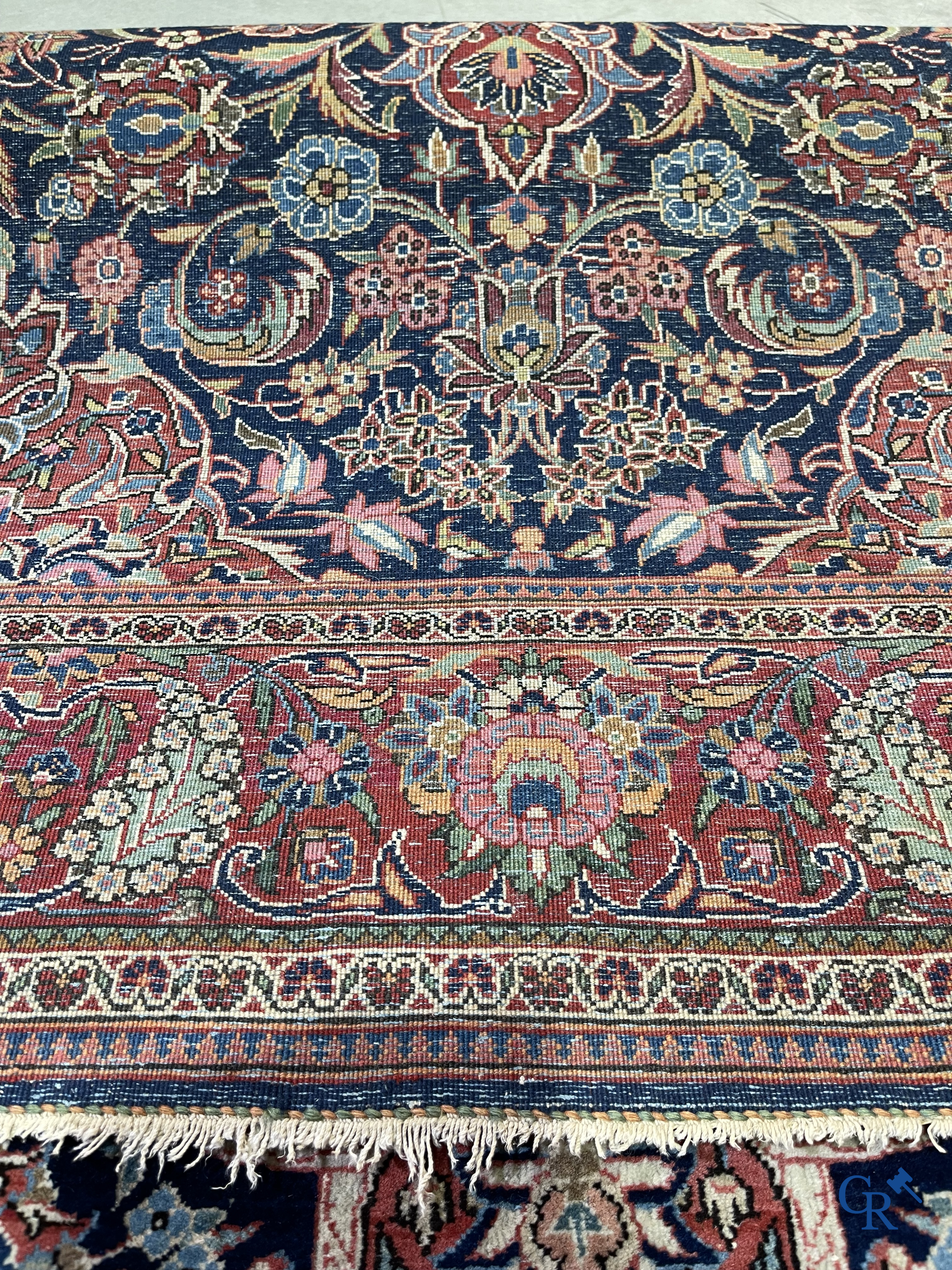 Oriental carpets: Iran. 2 antique hand-knotted Persian carpets with floral decor.