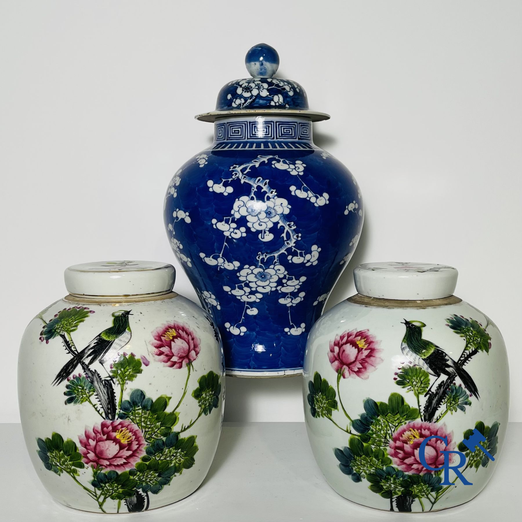 Chinese porcelain: a blue and white lid vase and a few ginger jars.