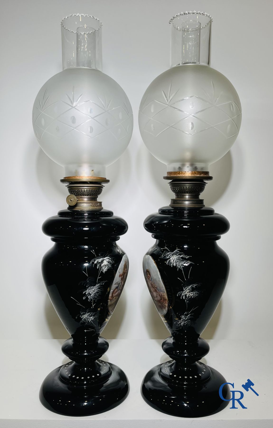 Pair of oil lamps in black opaline with enamelled decor.