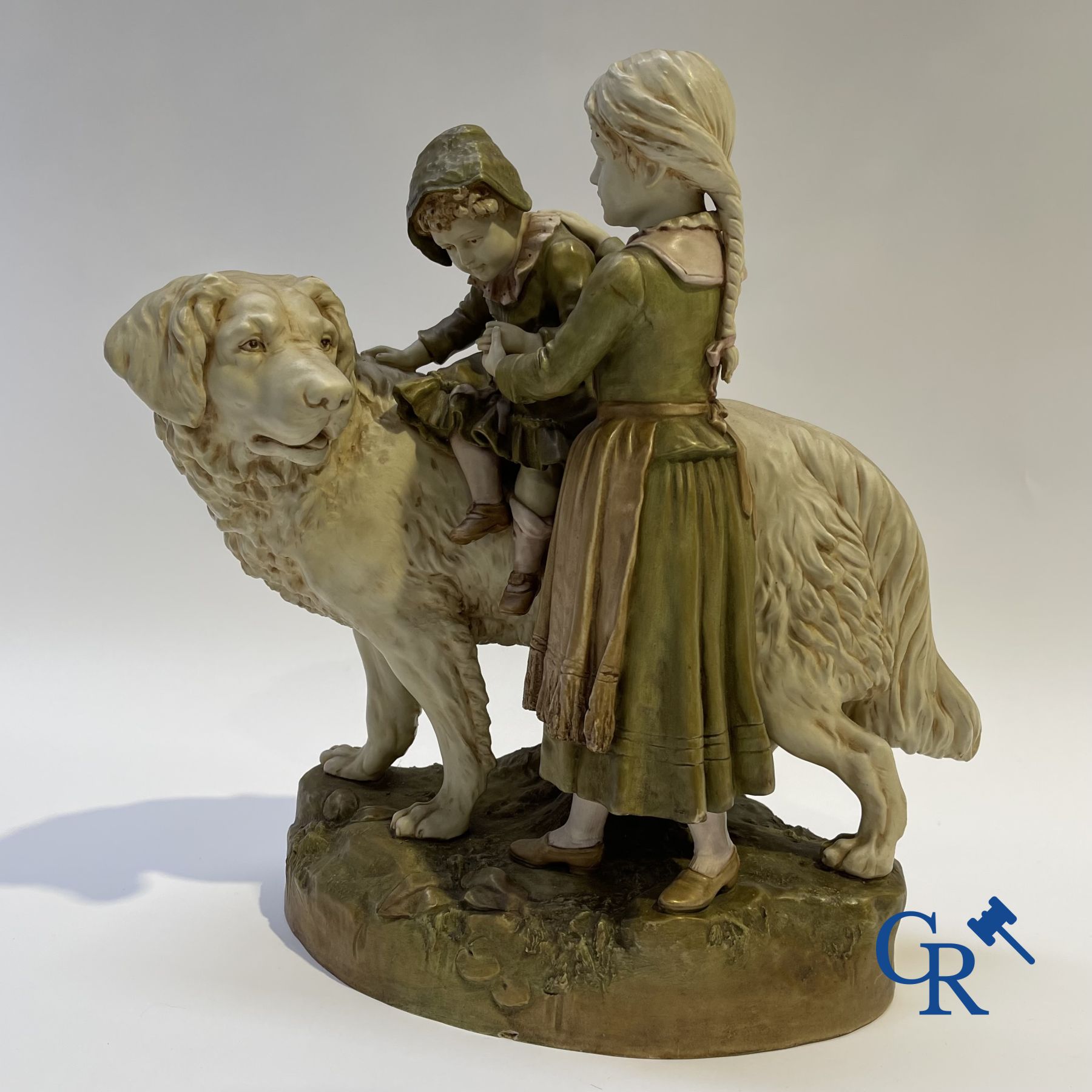 Porcelain: Royal Dux. A polychrome representation of a Saint Bernard dog with children.