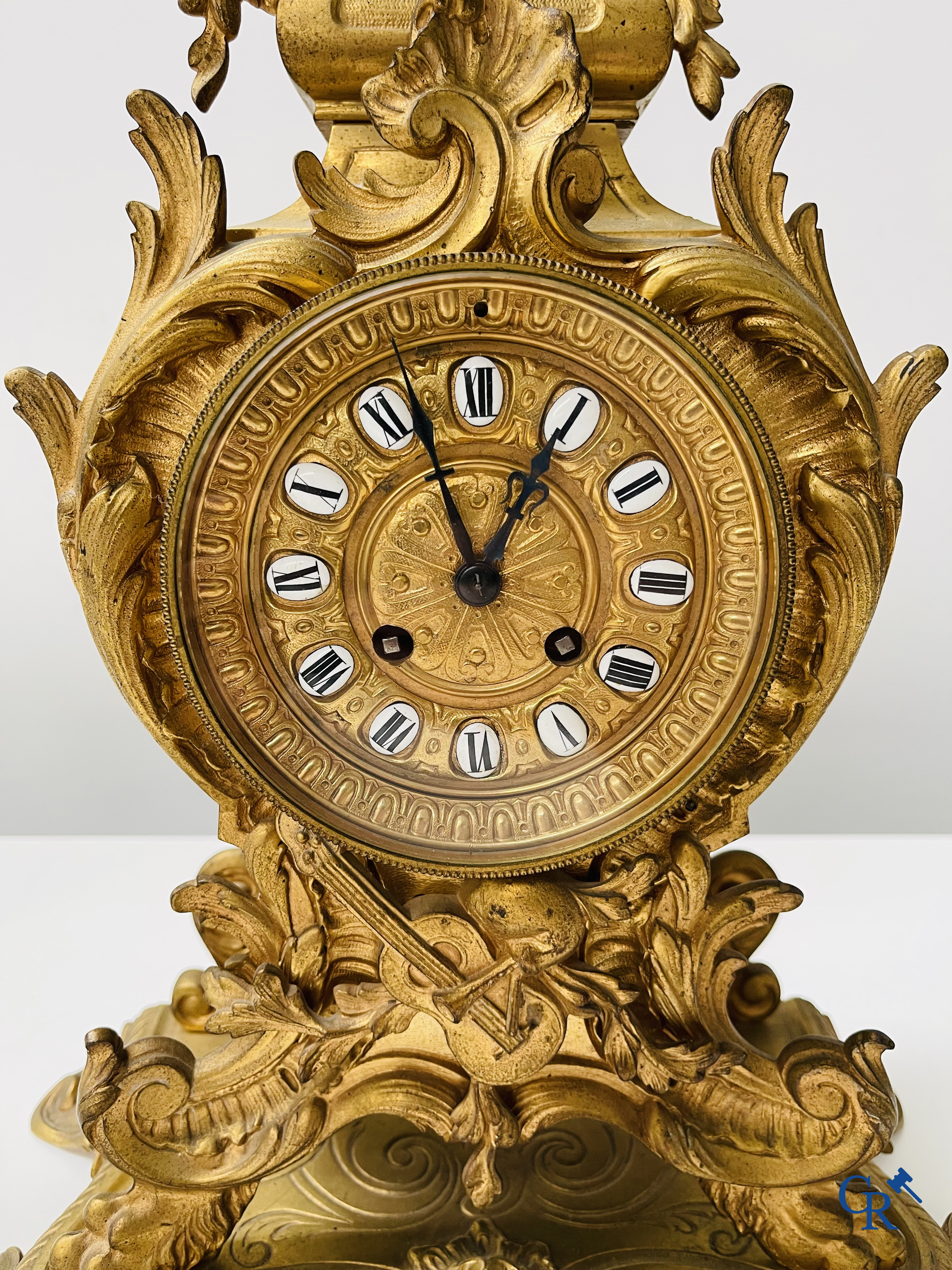 3-piece clock set in gilded bronze. Bronze dial with enamelled Roman numerals. LXV style. Period 1900.