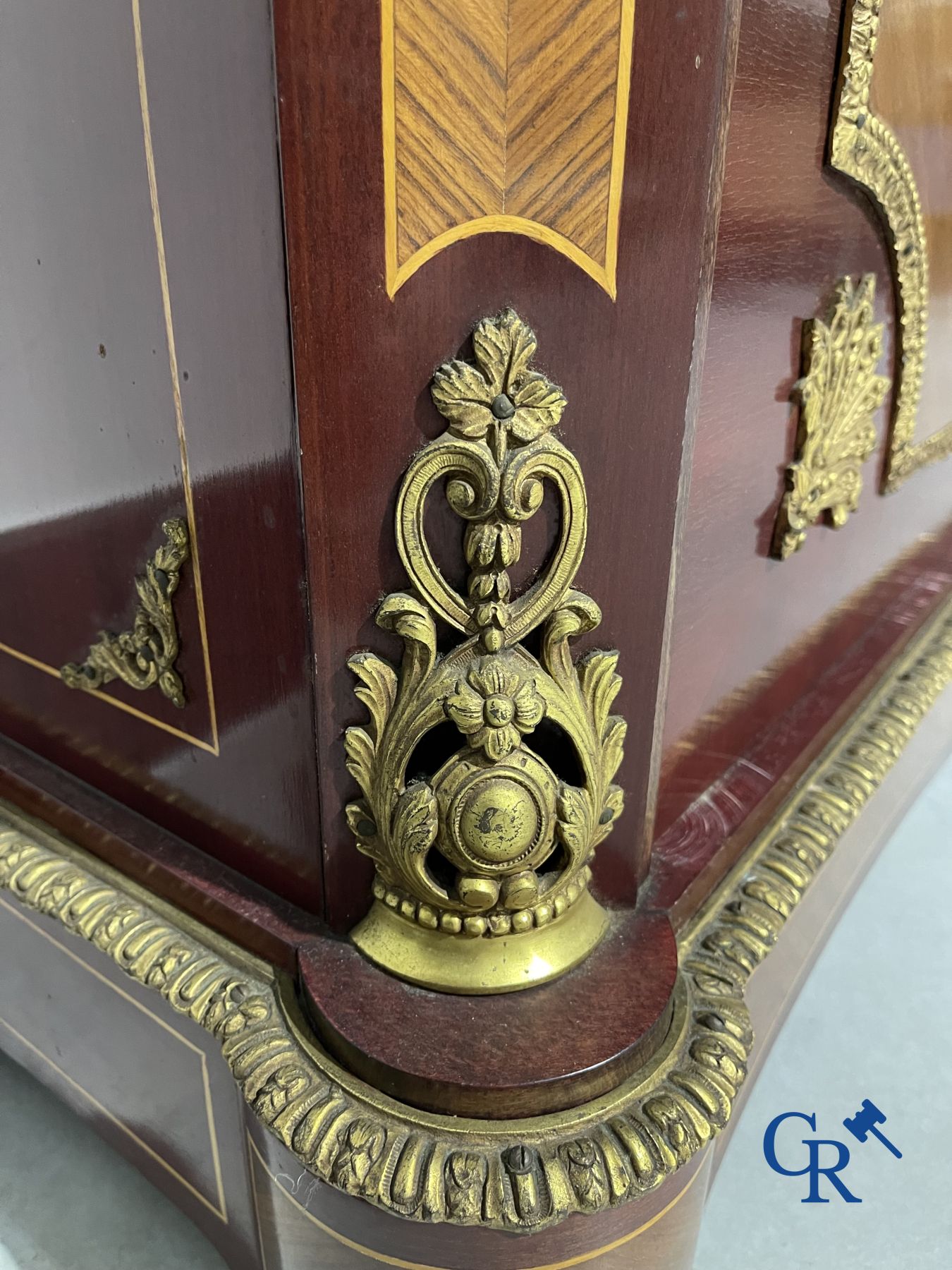 2-doors cabinet in LVI style with bronze fittings and a marble top.