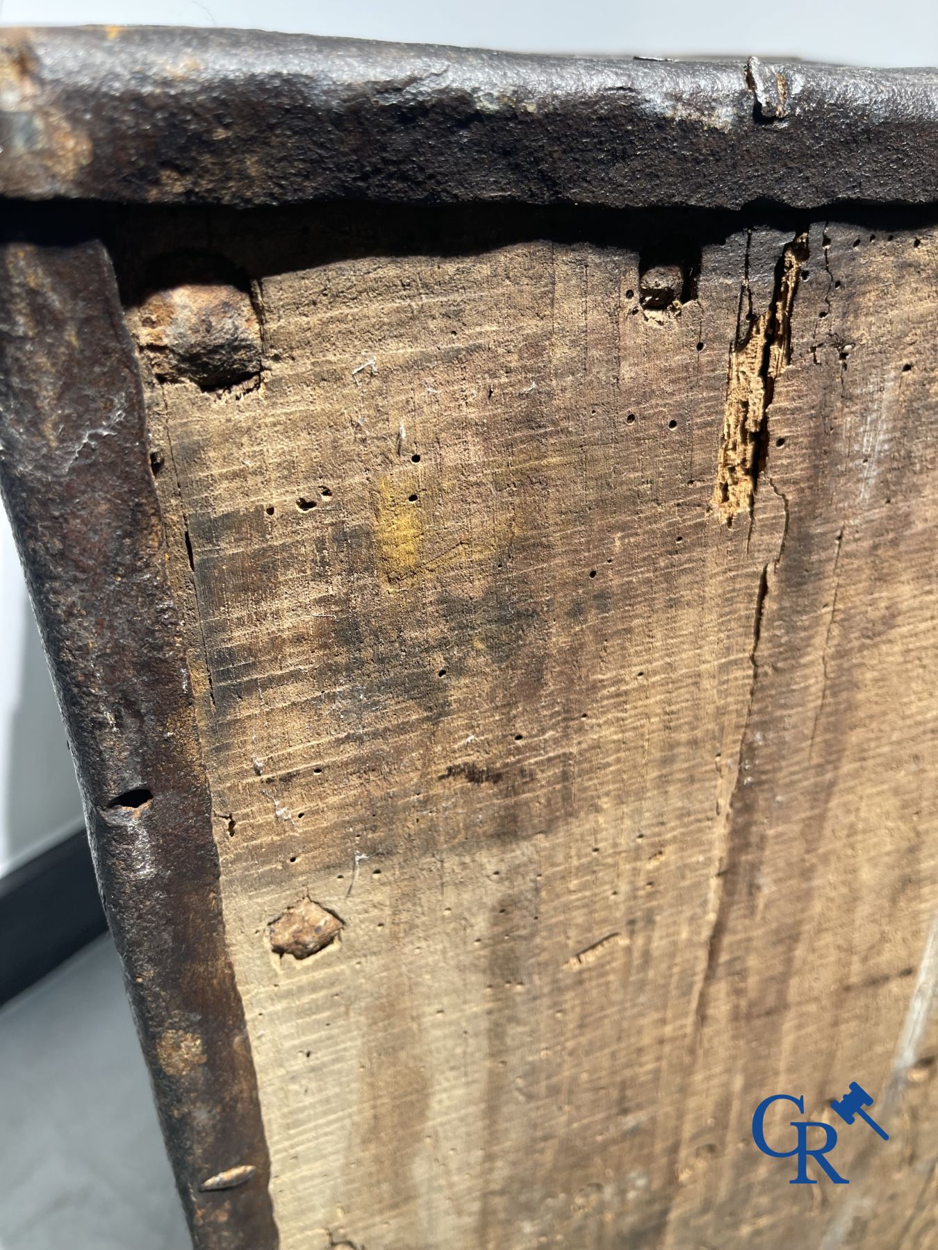 Antique wooden chest with hardware and lockwork in forging.