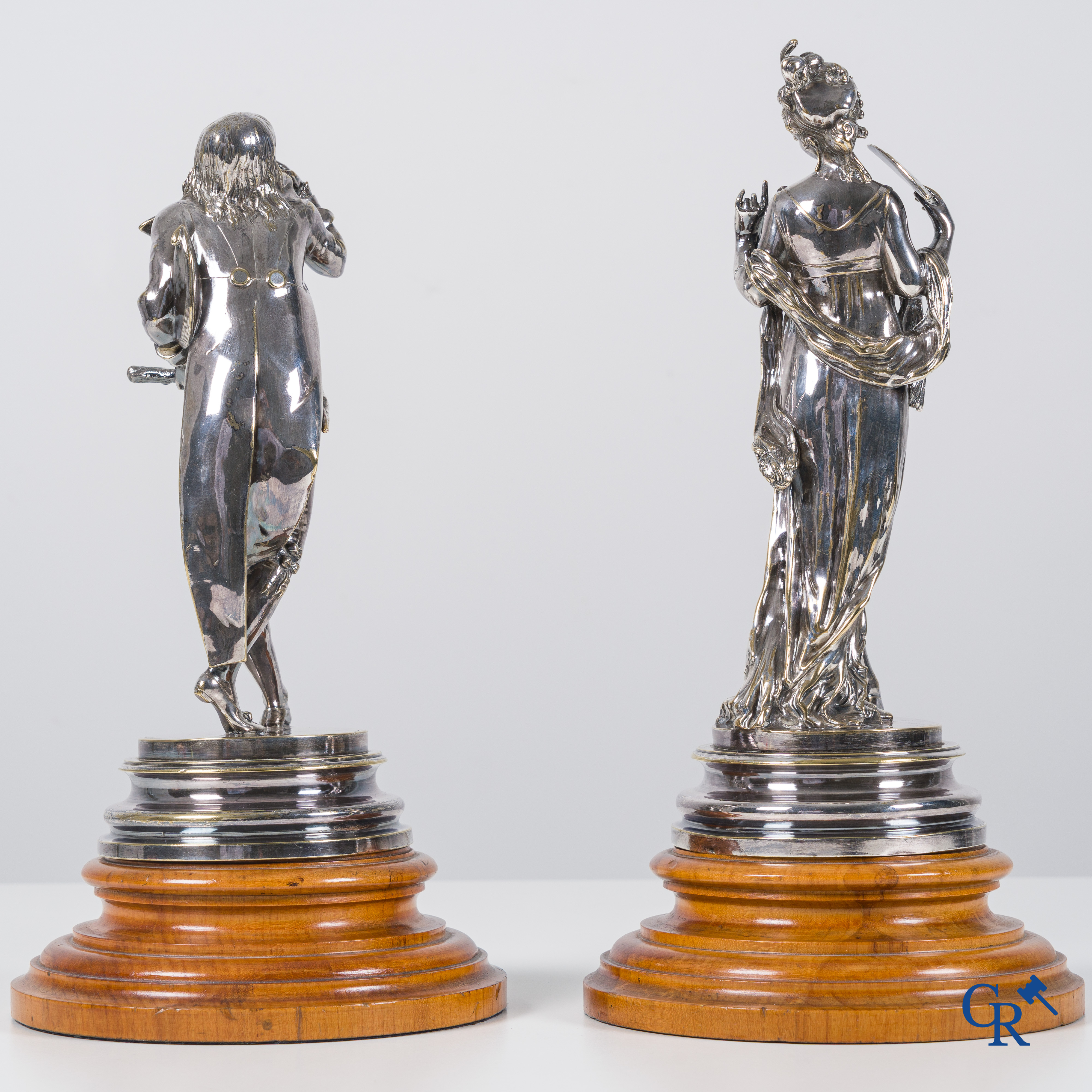 Auguste Lalouette (1826-1883) Les Incroyables/Merveilleuses. A pair of silvered bronze statues.