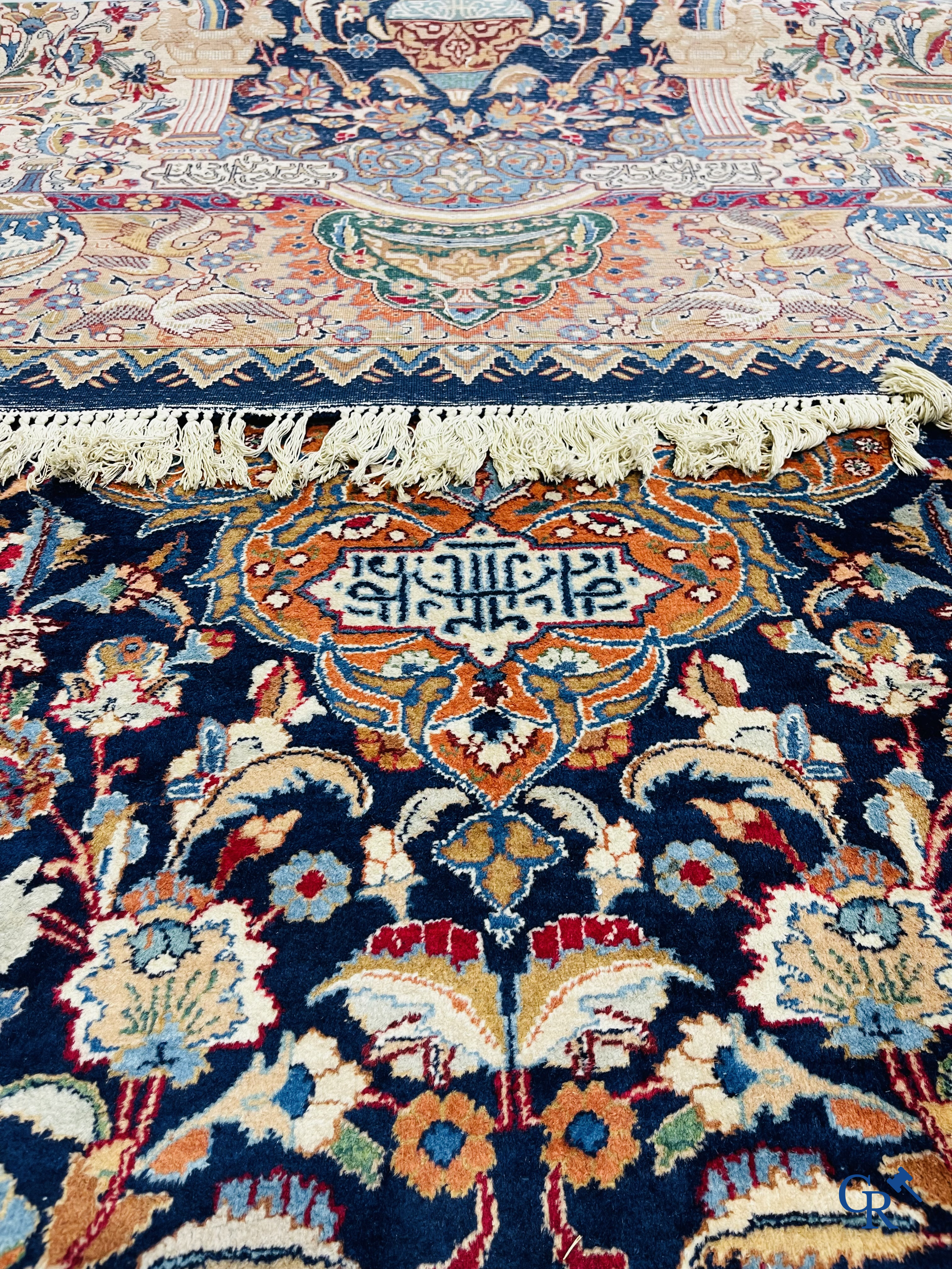 Oriental carpets: A large hand-knotted oriental carpet with antique decor. Multiple inscriptions.