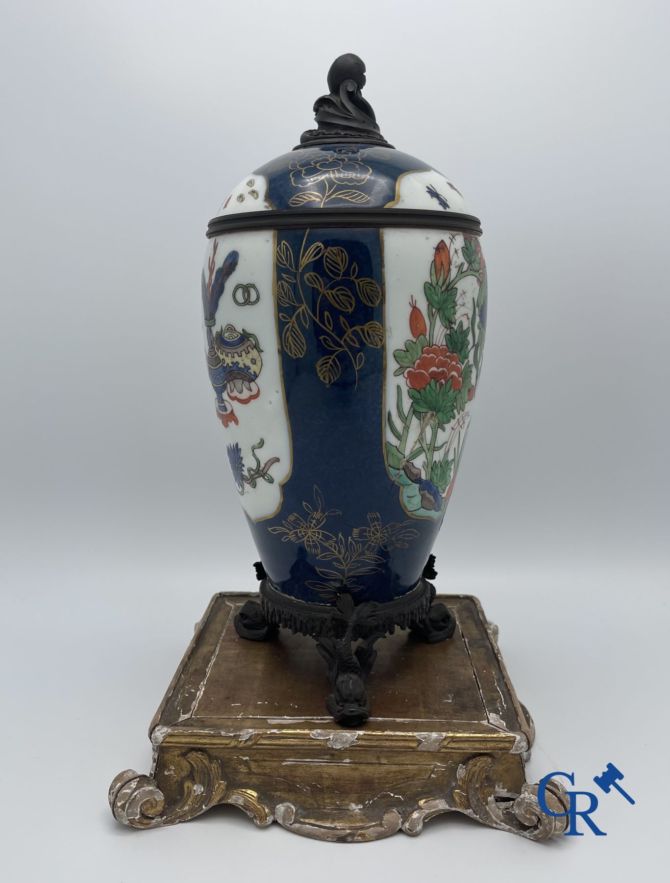 A porcelain table fountain with bronze fittings.