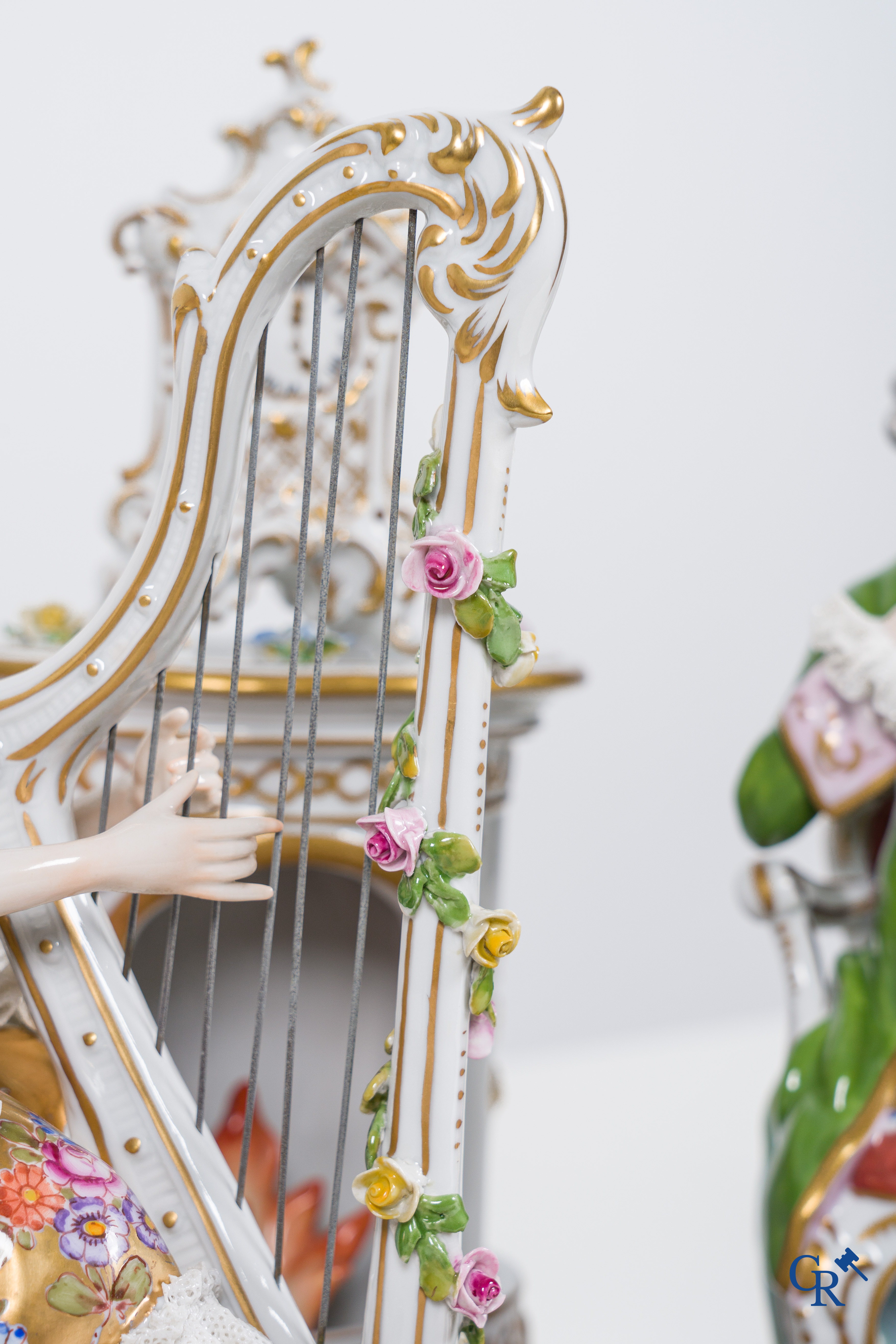 Volkstedt Rudolstadt, Large group in lace porcelain, harp playing lady in a richly decorated interior. Marked.