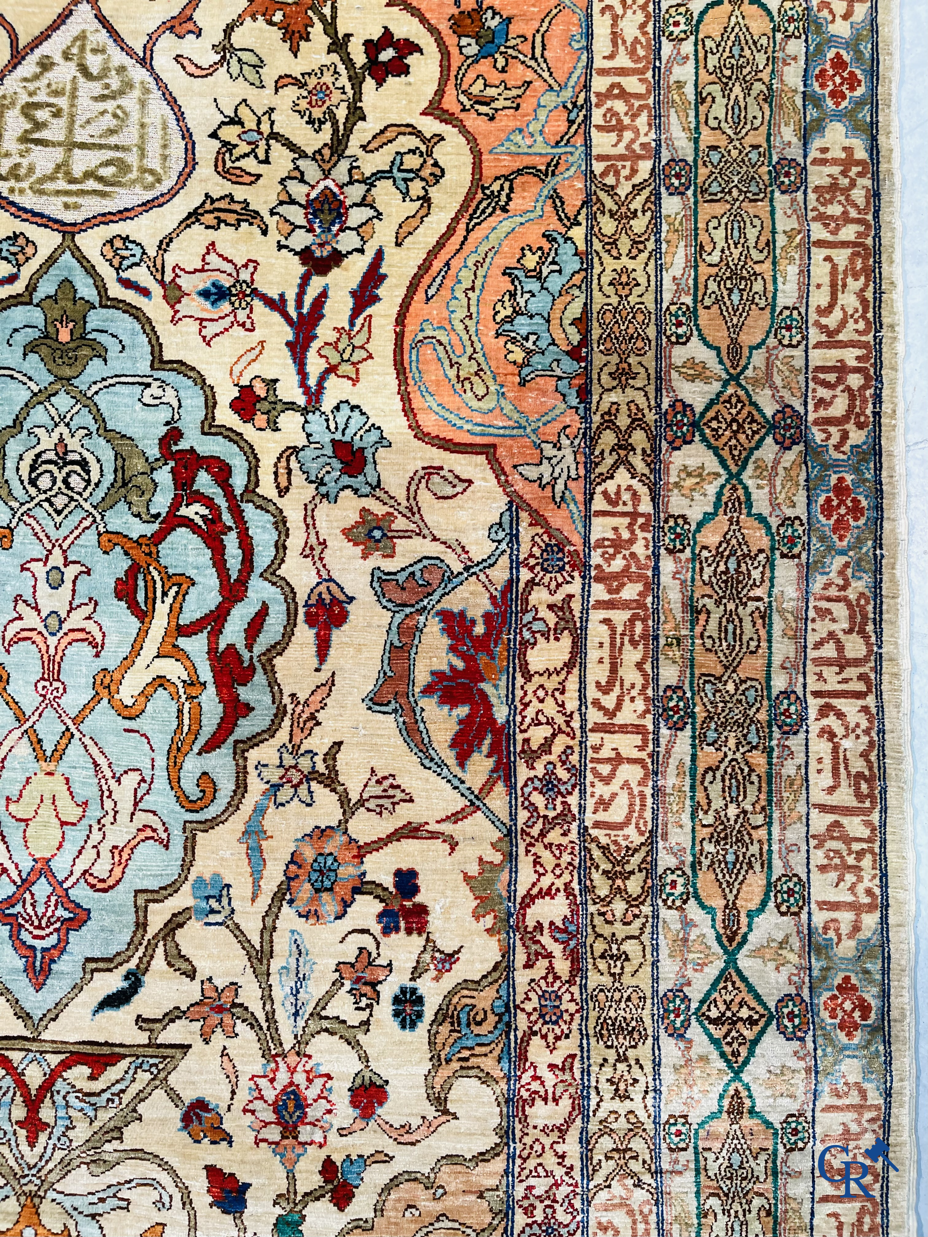 Oriental carpets, Hereke Turkey, a finely hand-knotted silk carpet with inscriptions and gold thread.