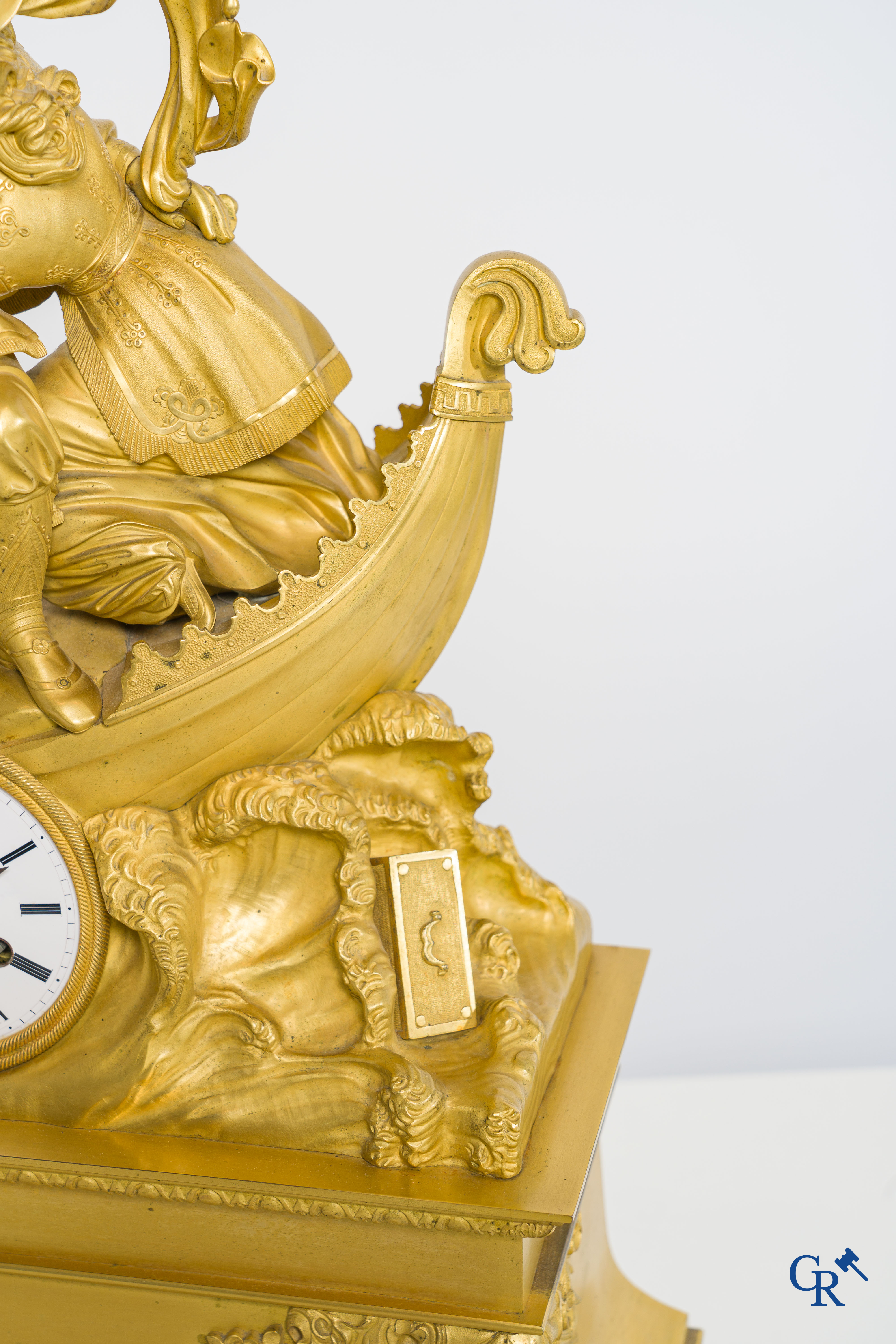 Butet horlogier à Paris. Gilded bronze chimney clock with enamelled dial. Charles X period.