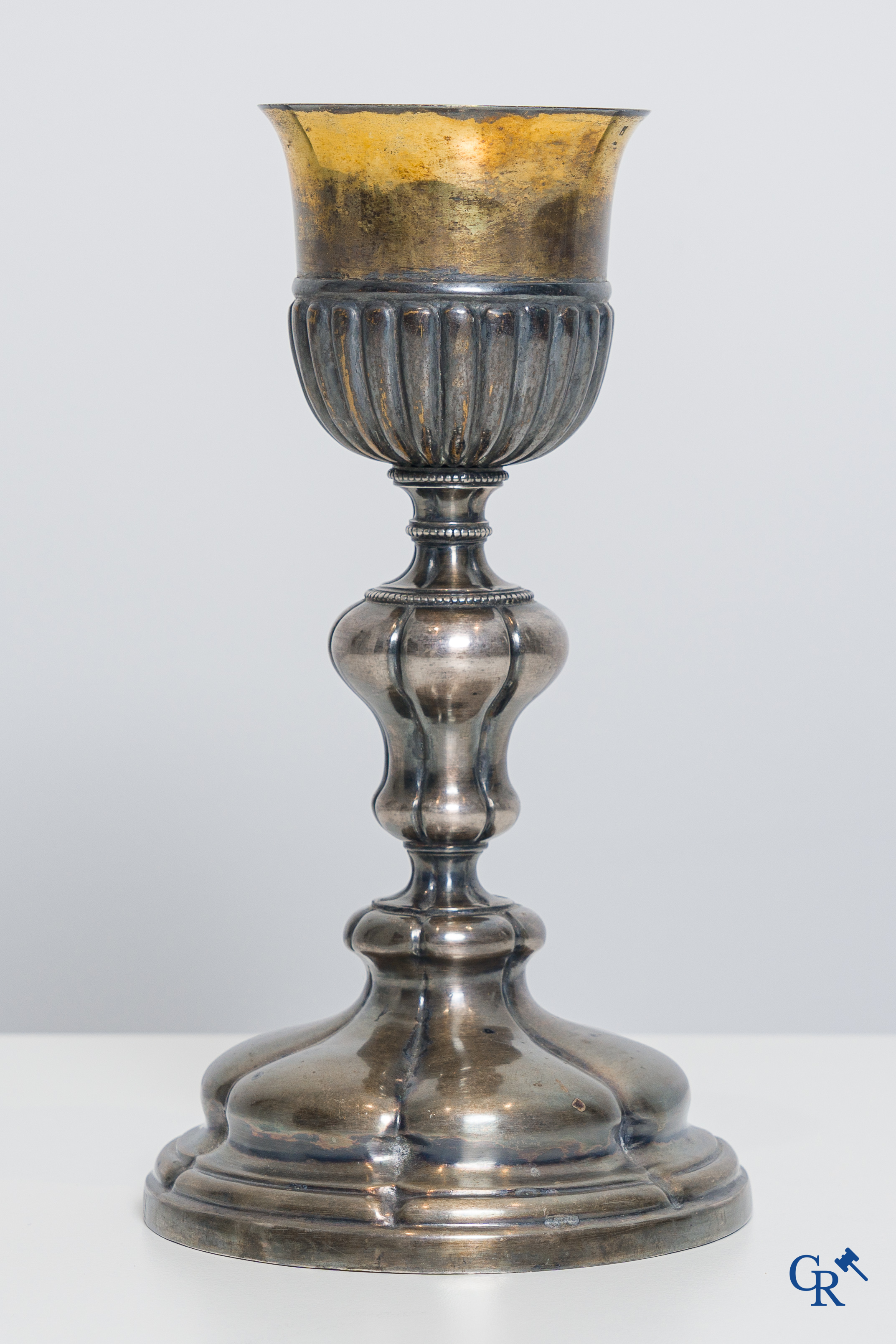 Religious objects. A silver- and gold plated chalice with Memento Donatoris inscriptions.