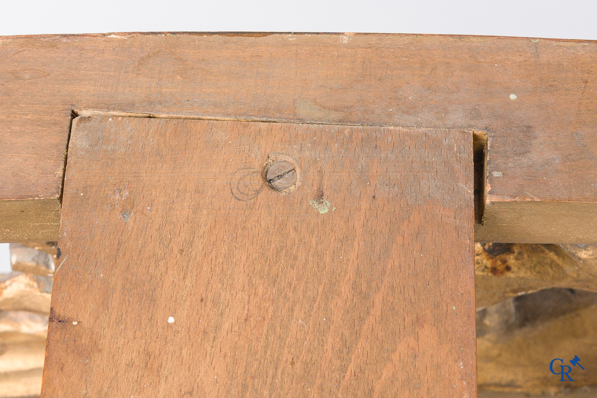 A richly carved and gilded console table in LVXI style with a grisaille painting on marble.