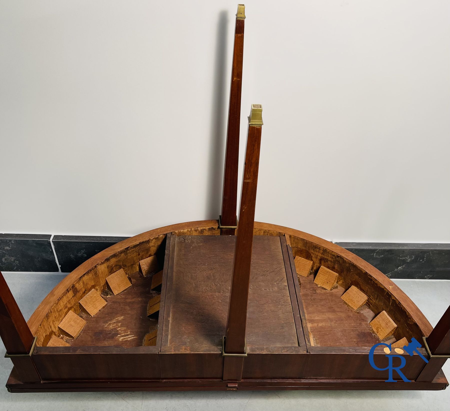 Furniture: fold-out crescent-shaped mahogany table. Directoire period.