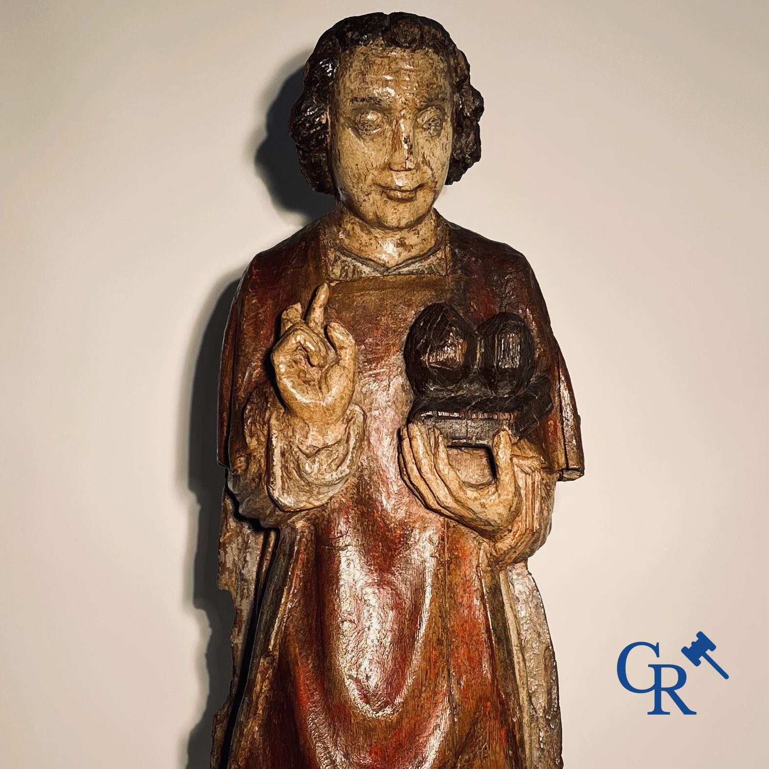 Wooden sculpture: Polychrome wood sculpture of a saint. Saint Stephen. Probably 17th century.