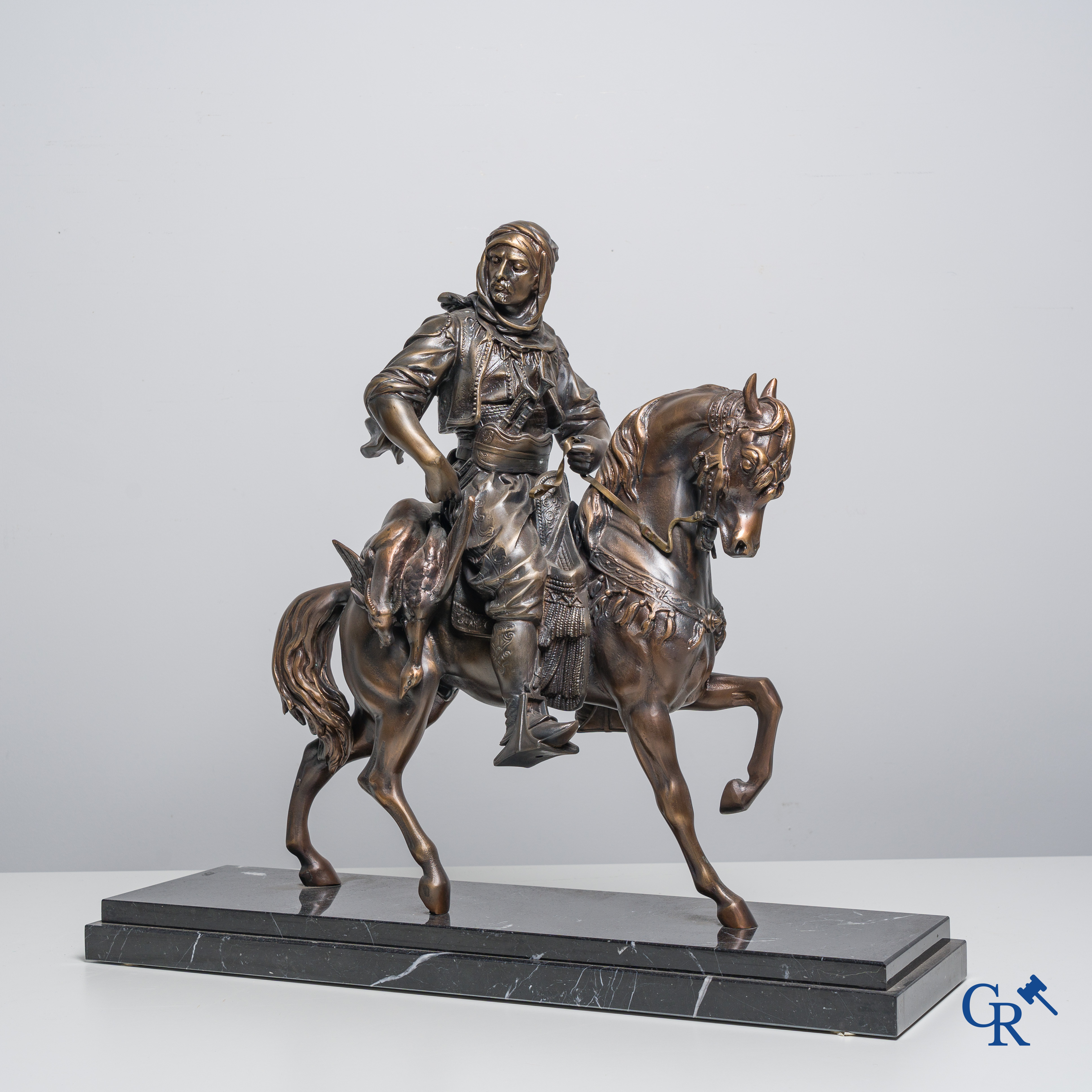 Spelter sculpture on a black marble pedestal, Arabian rider on horseback. 20th century.