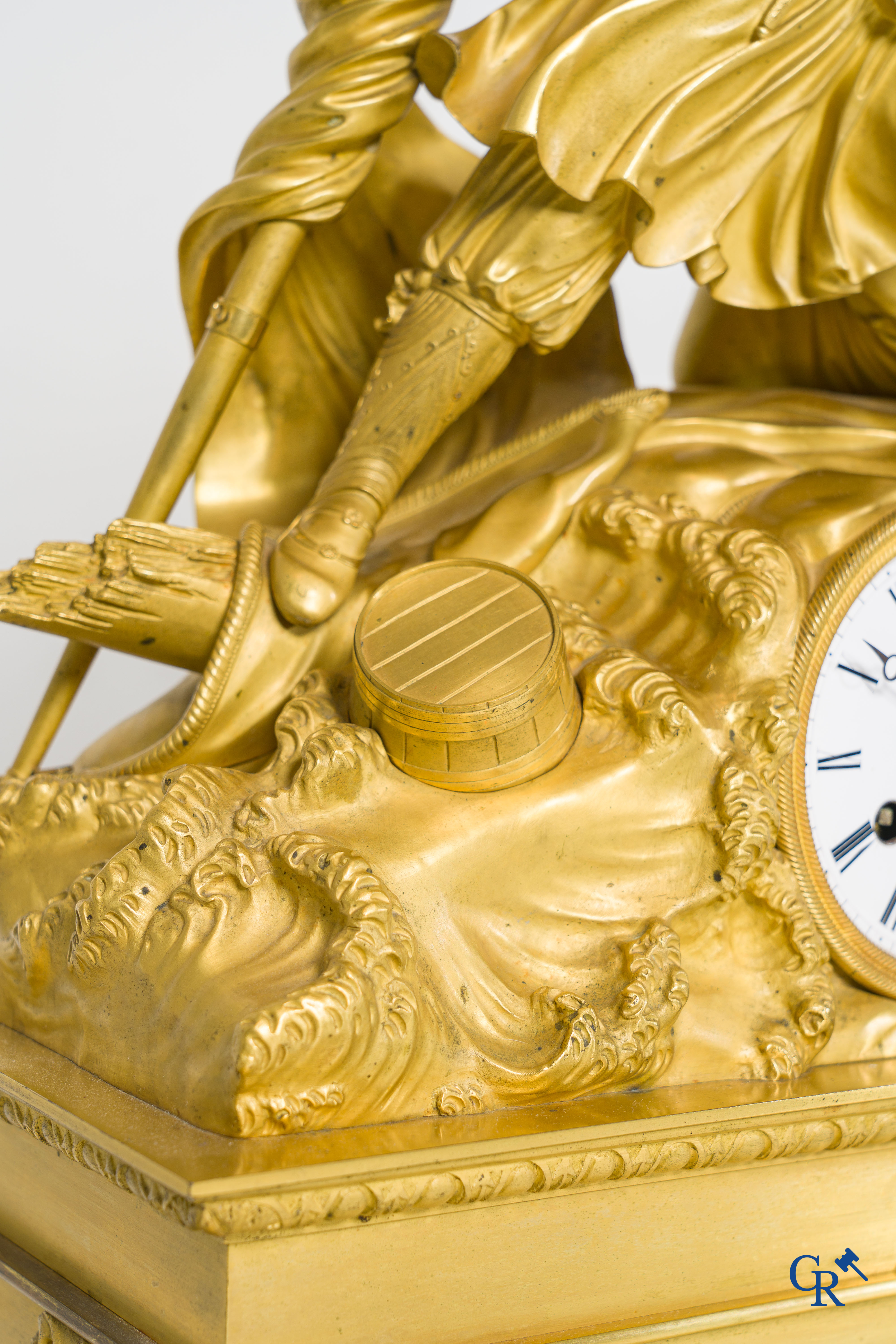 Butet horlogier à Paris. Gilded bronze chimney clock with enamelled dial. Charles X period.