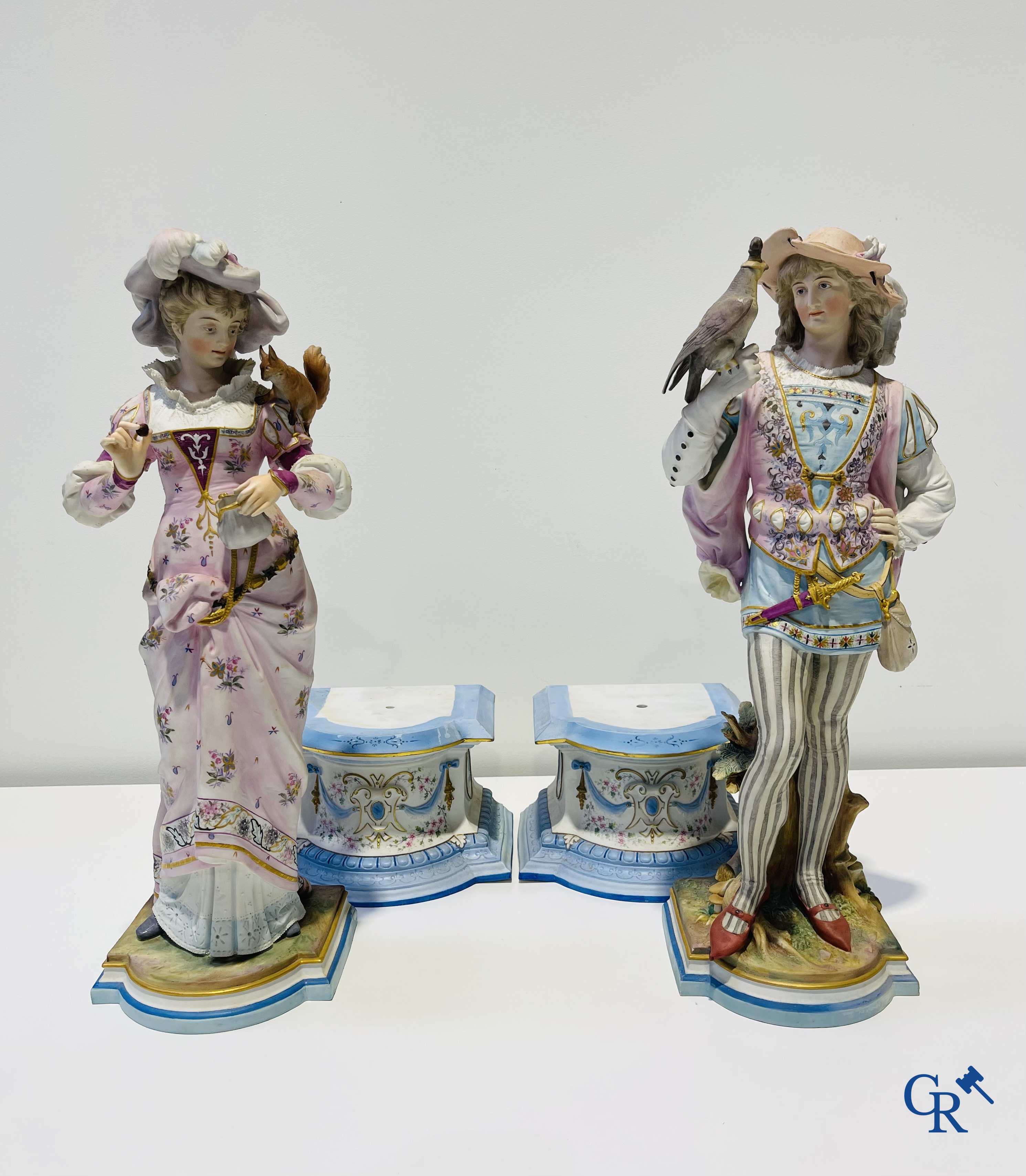 Exceptional pair of large statues in coloured and gilded biscuit porcelain. 2nd half of the 19th century.