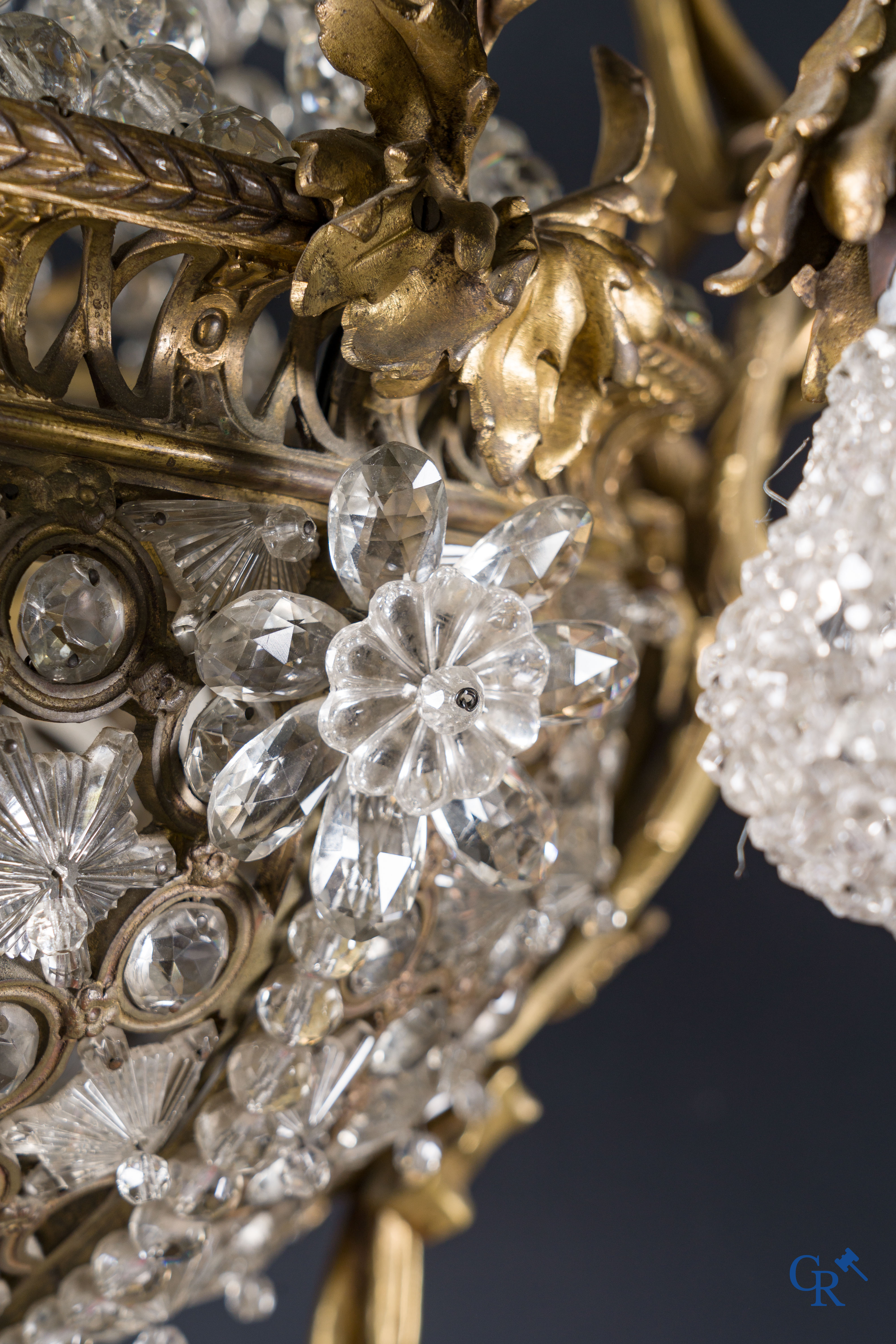 An imposing bronze and crystal chandelier in LXVI style. Circa 1920.