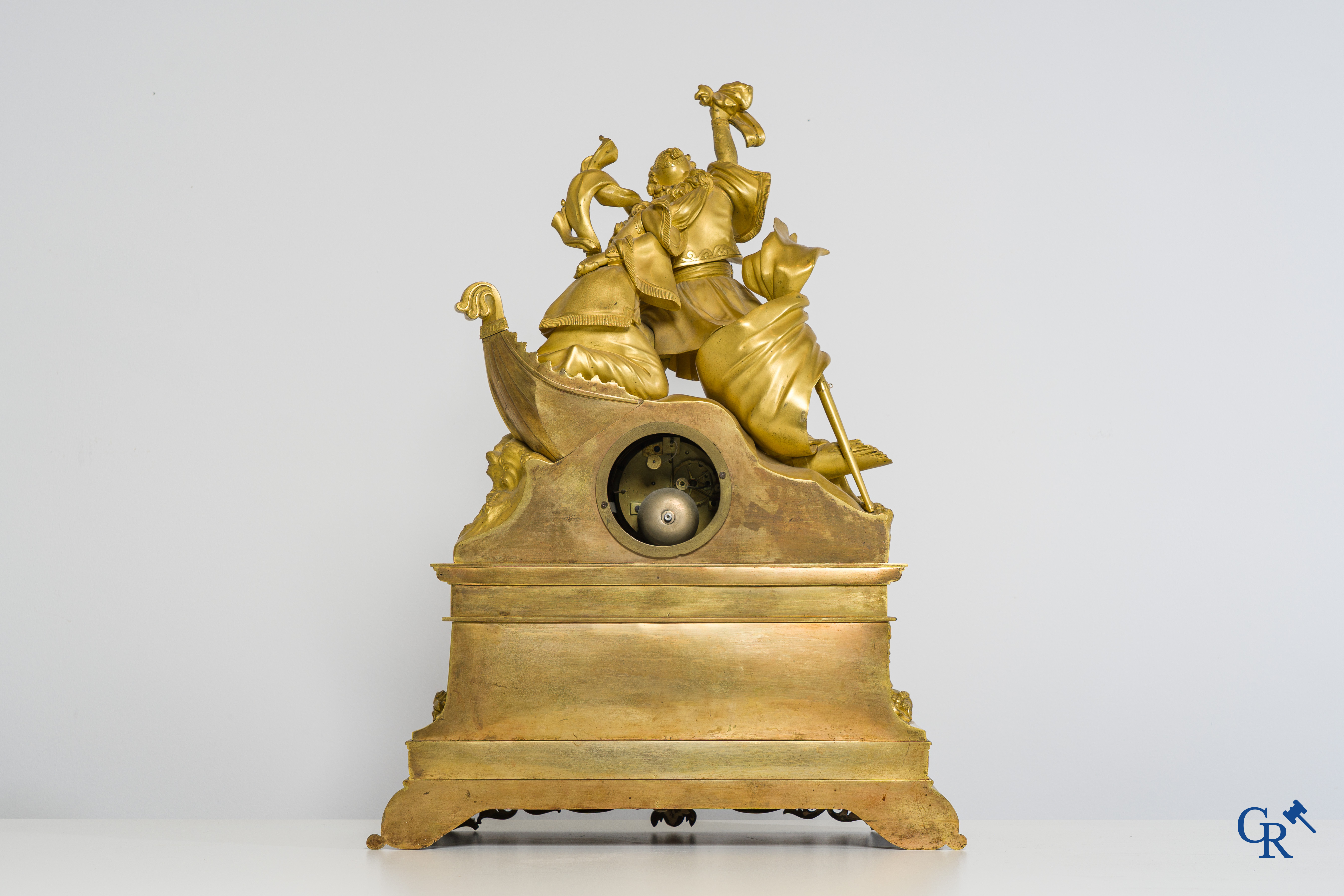 Butet horlogier à Paris. Gilded bronze chimney clock with enamelled dial. Charles X period.