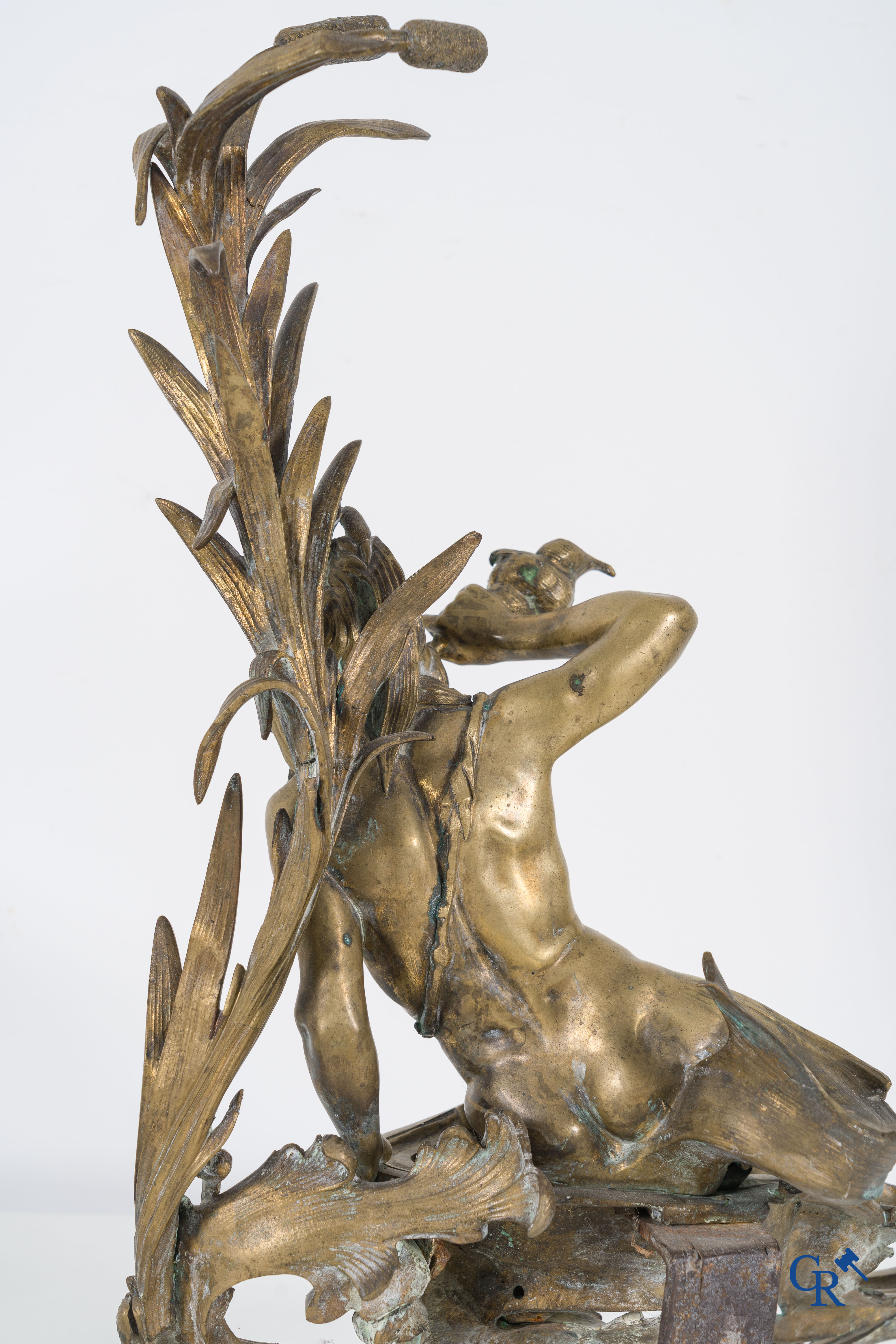 A large pair of finely chiseled bronze chenets with Tritons. Louis XV style. Napoleon III period.