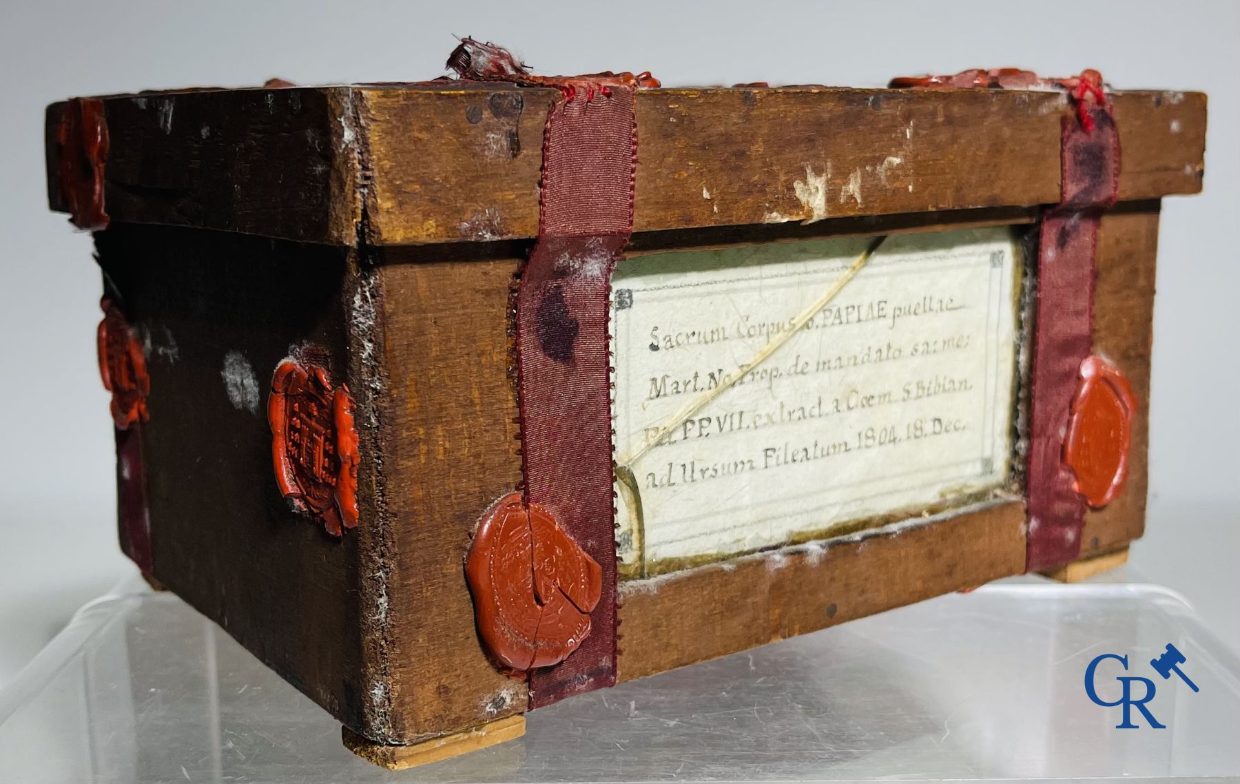 An antique wooden reliquary sealed with wax seals. Early 19th century.