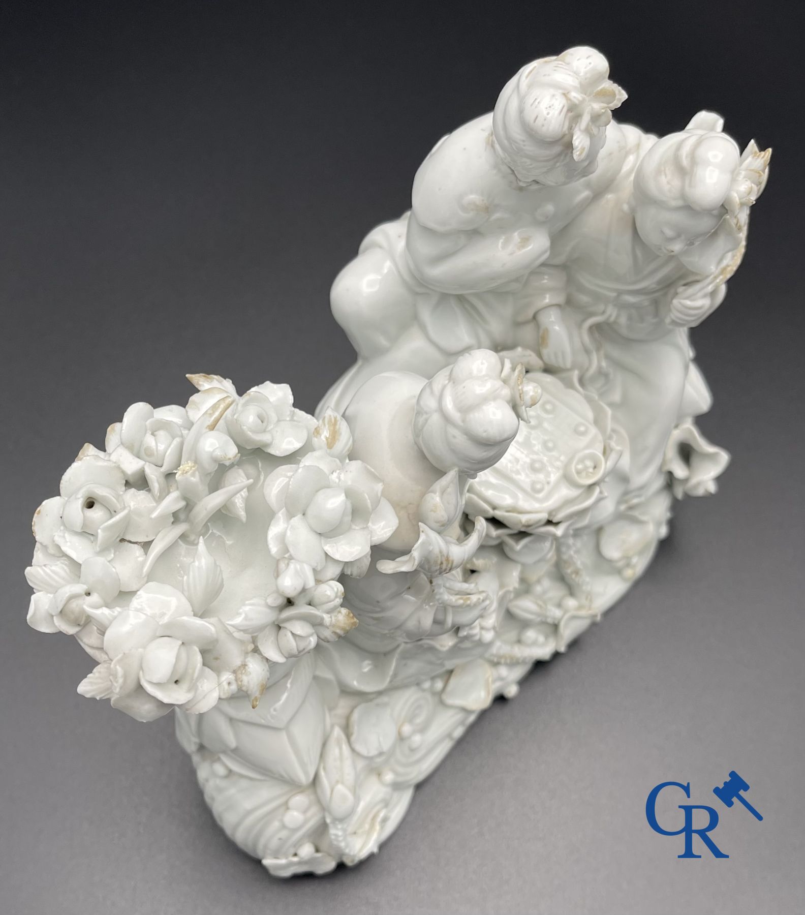 Chinese porcelain: A Buddhist lion and a group in blanc de Chine.