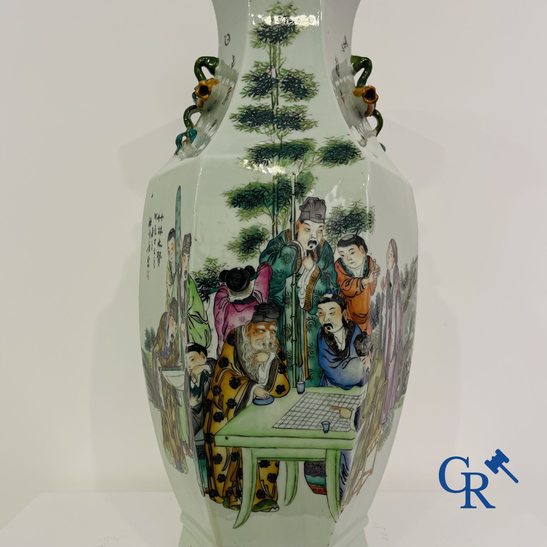 Asian Art: Chinese porcelain. A hexagonal Chinese Famille rose vase with sages and scholars. 19/20th century.