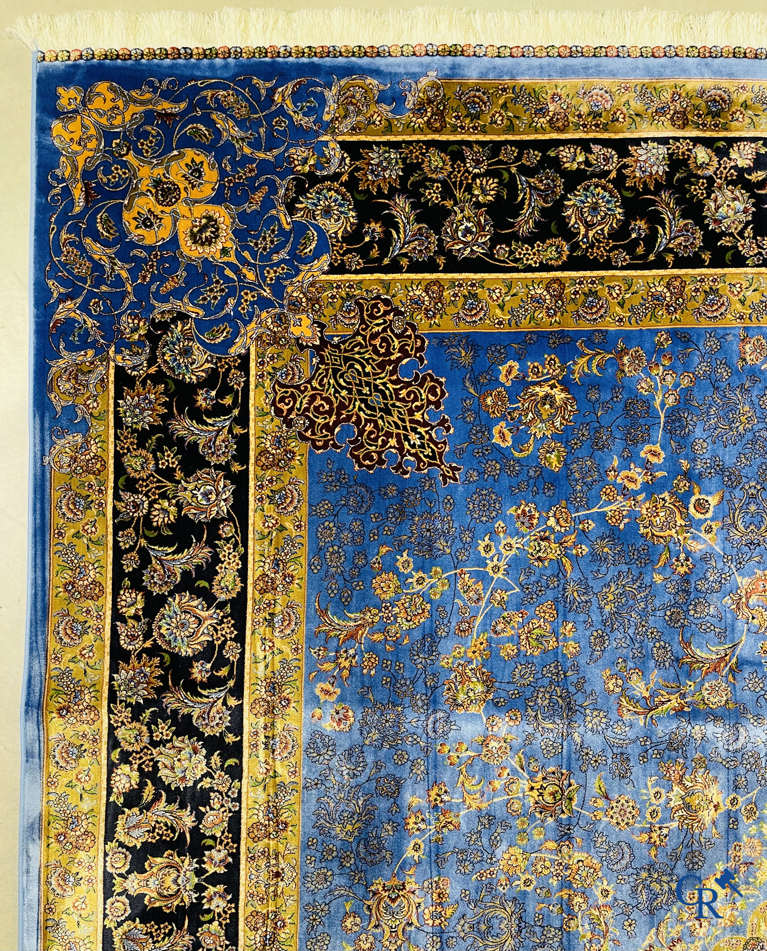 Carpets. Exceptional silk carpet with floral decor on a blue background.