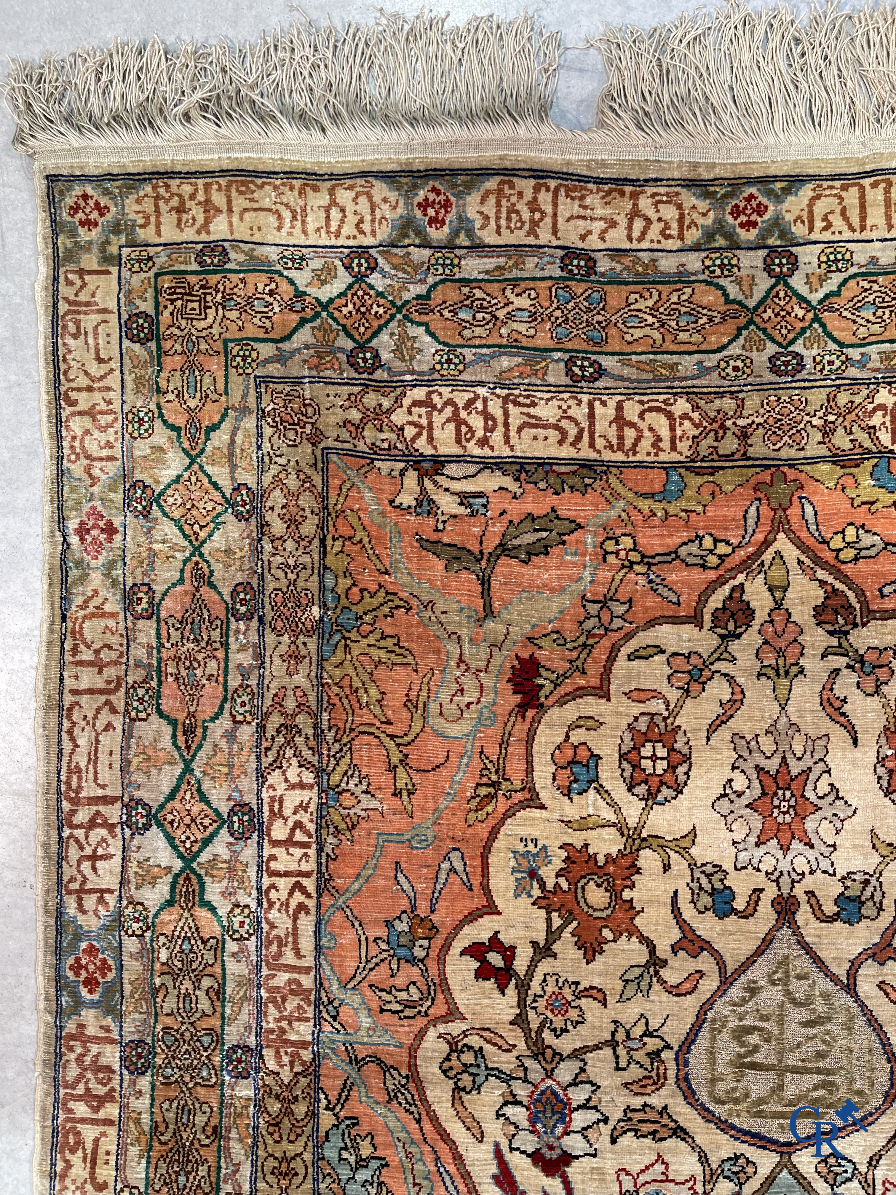 Oriental carpets, Hereke Turkey, a finely hand-knotted silk carpet with inscriptions and gold thread.