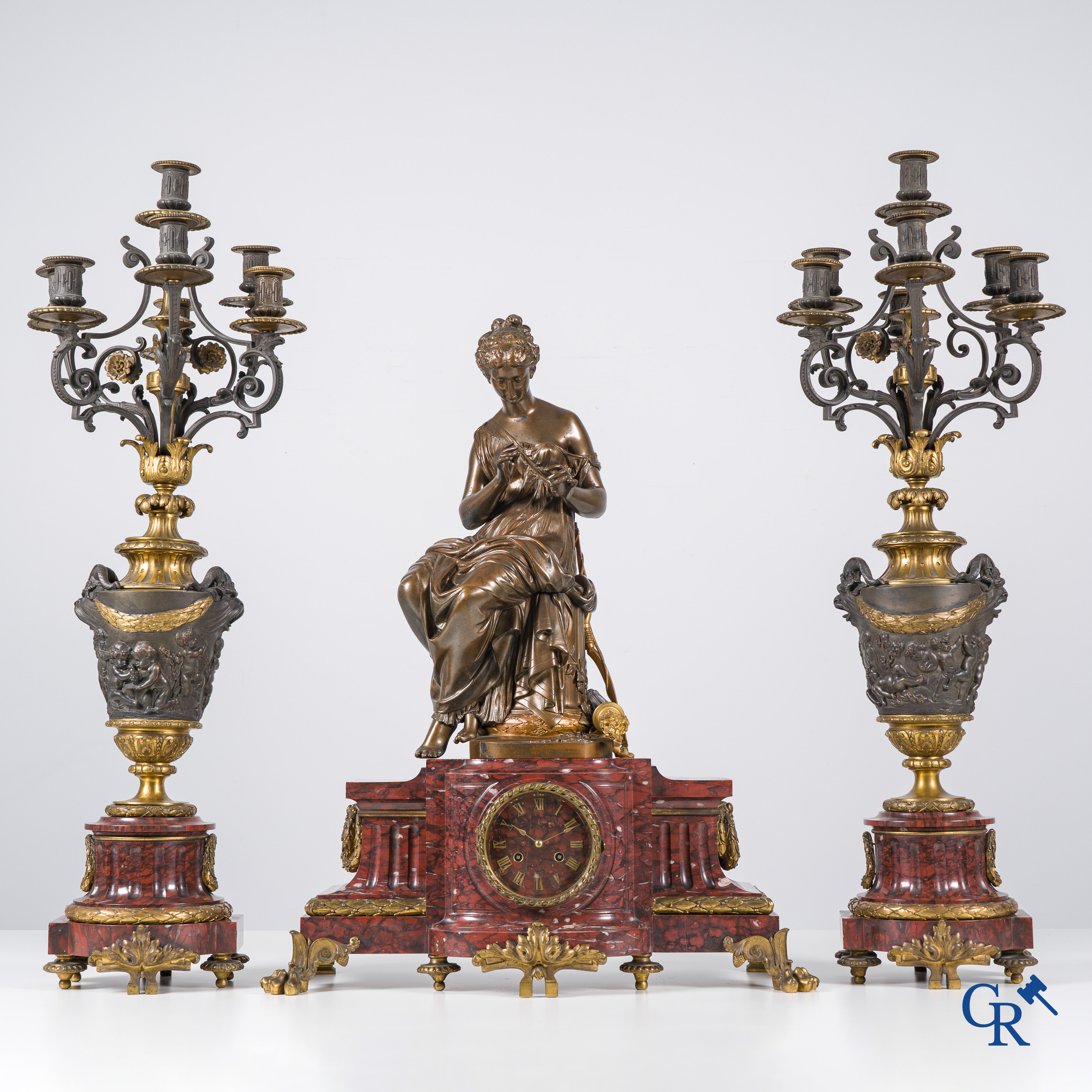 Charpentier à Paris, An imposing 3-piece fireplace clockset in gilded and patinated bronze. Late 19th century.