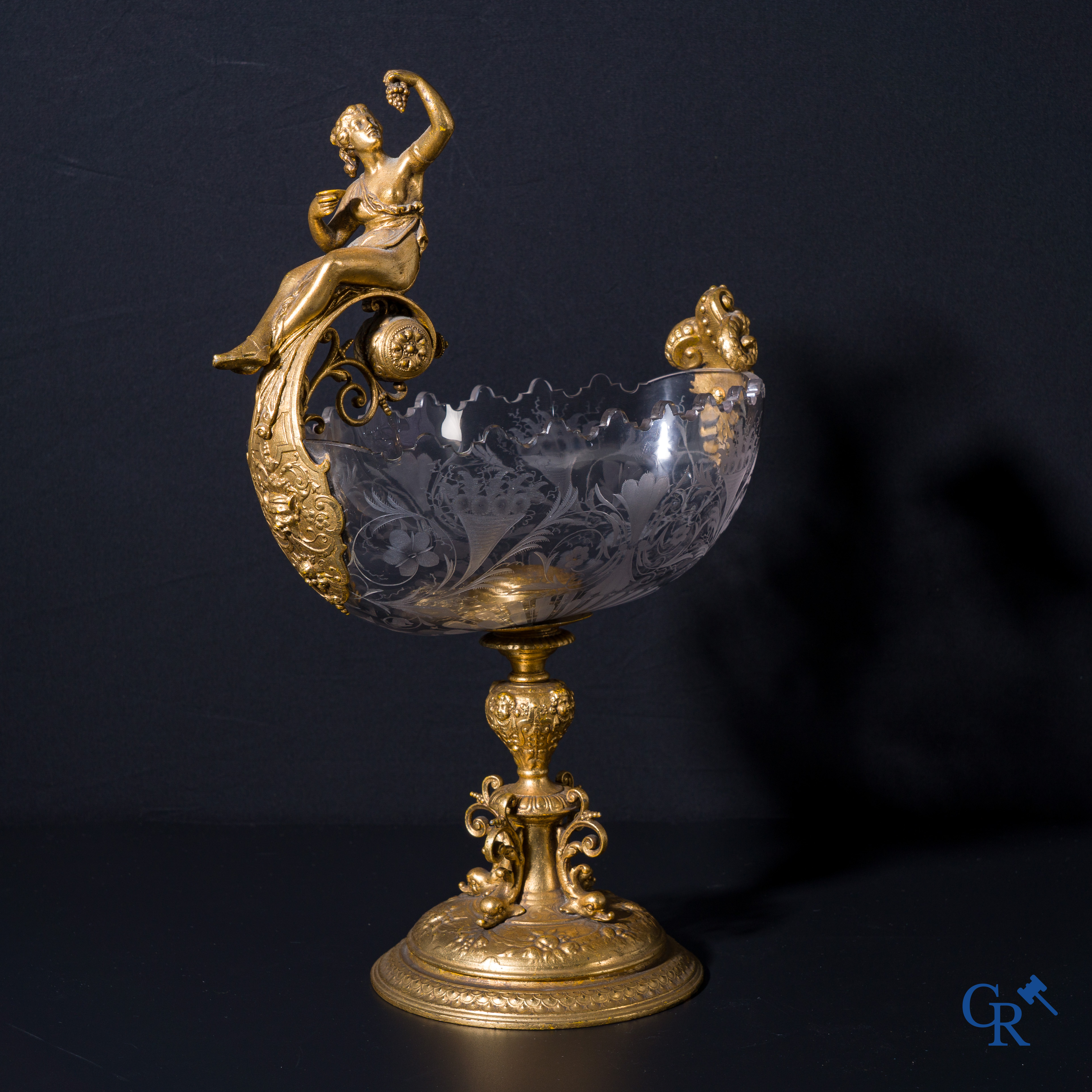 A gilded Renaissance-style table centerpiece with a richly cut crystal coupe. Late 19th century.