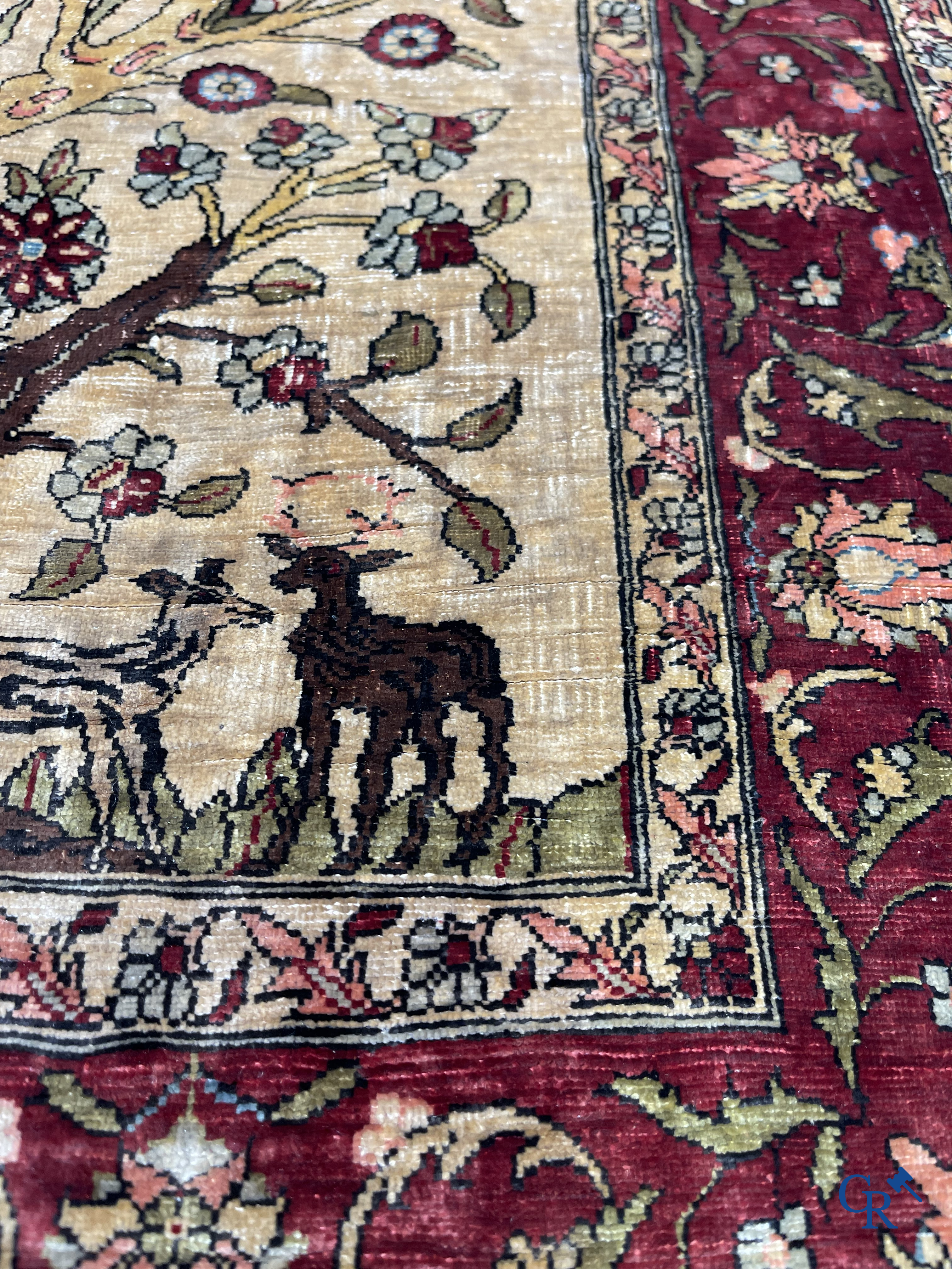 Oriental carpets, Hereke, a finely hand-knotted and signed silk carpet with a tree of life.