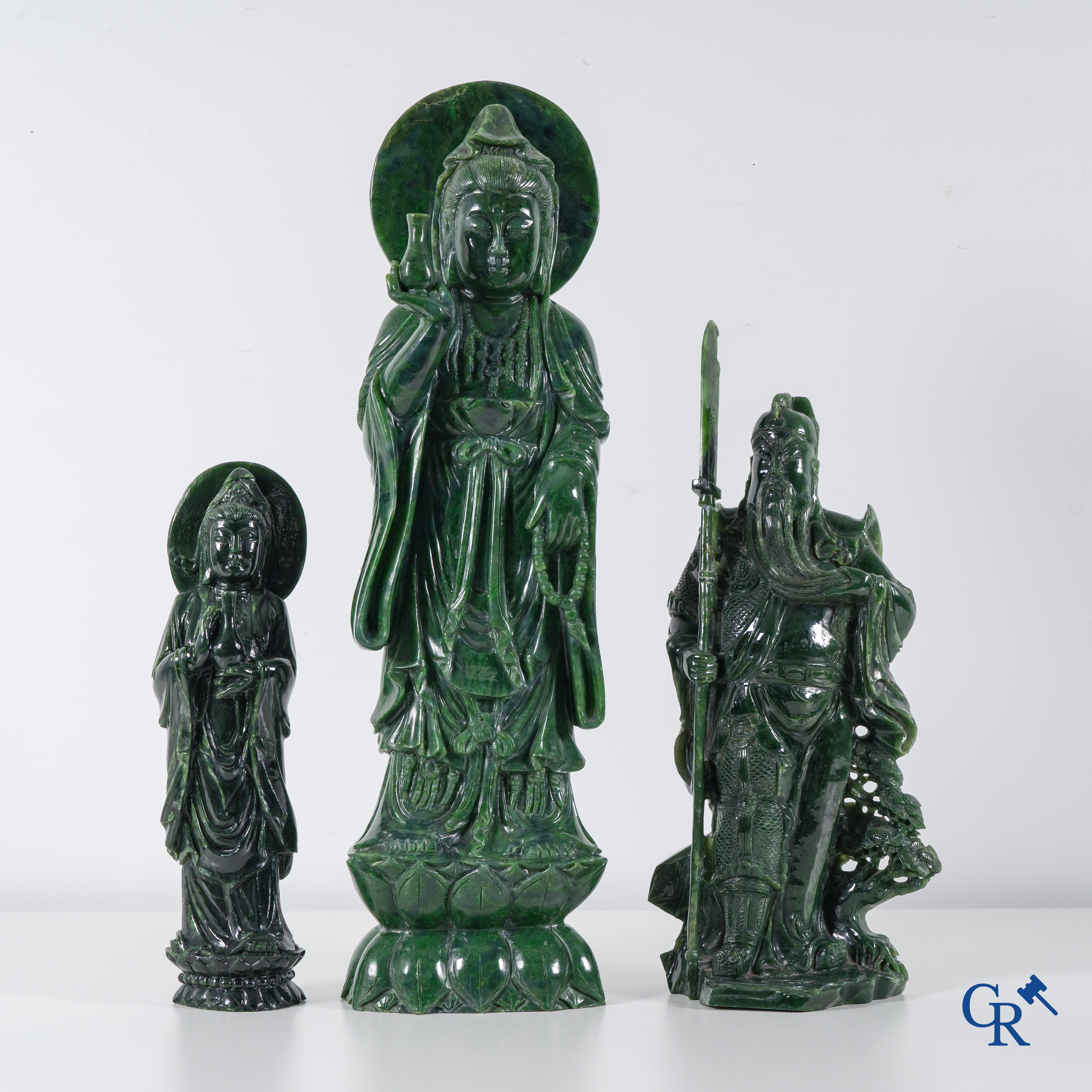 Asian Art: 3 Chinese jadeite figures of a standing Guanyin and a Chinese warrior. 20th century.