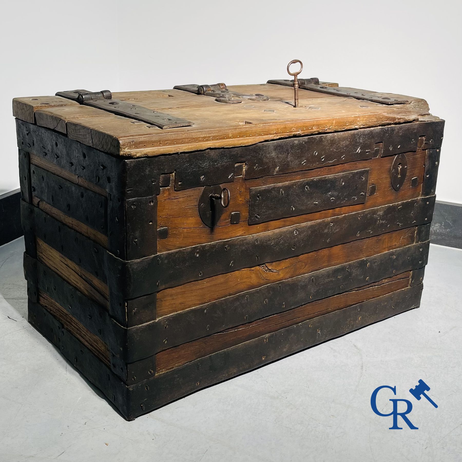 Antique wooden chest with hardware and lockwork in forging.