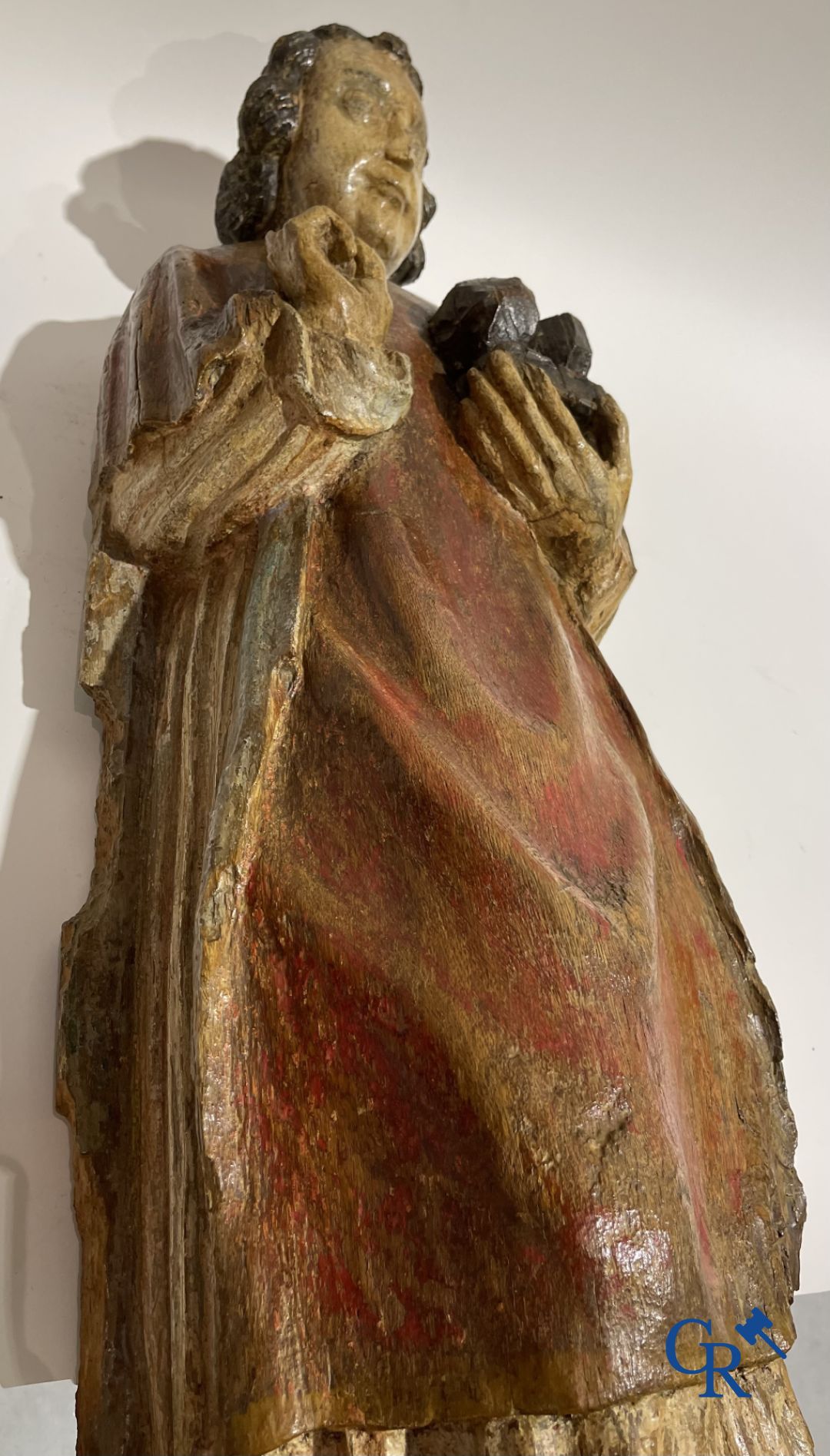 Wooden sculpture: Polychrome wood sculpture of a saint. Saint Stephen. Probably 17th century.