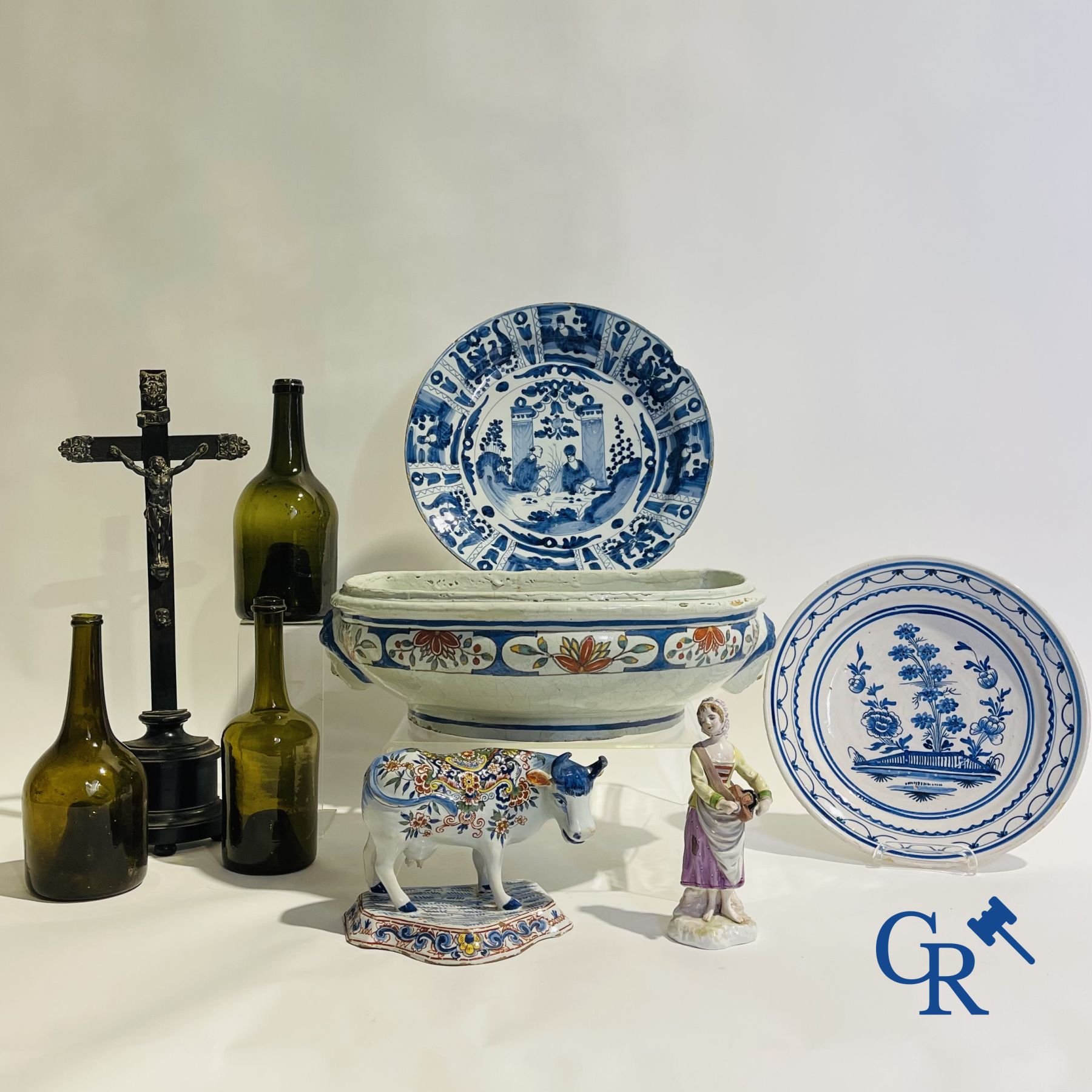 A part of a North French fountain and various pieces in faience and various antiques.