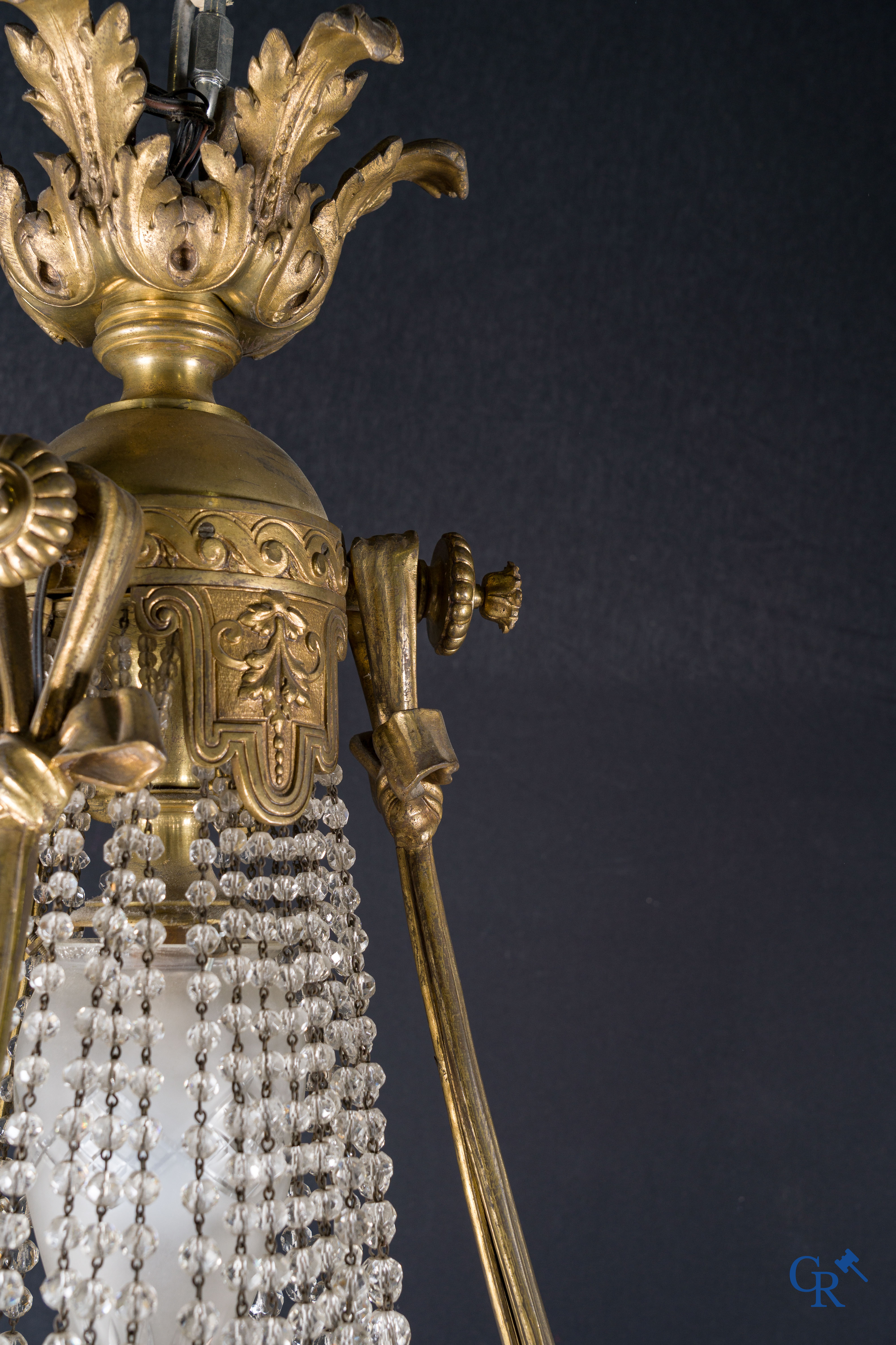 An imposing bronze and crystal chandelier in LXVI style. Circa 1920.