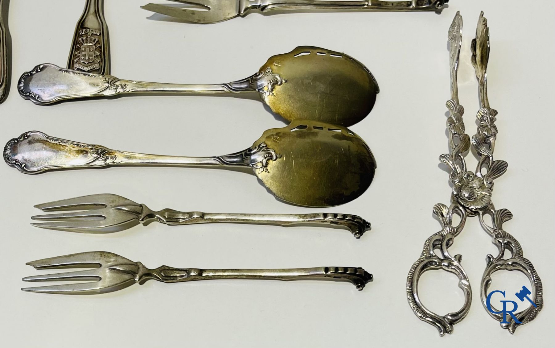 Silver: A lot of silver cutlery, a cake scoop and others including Delheid.