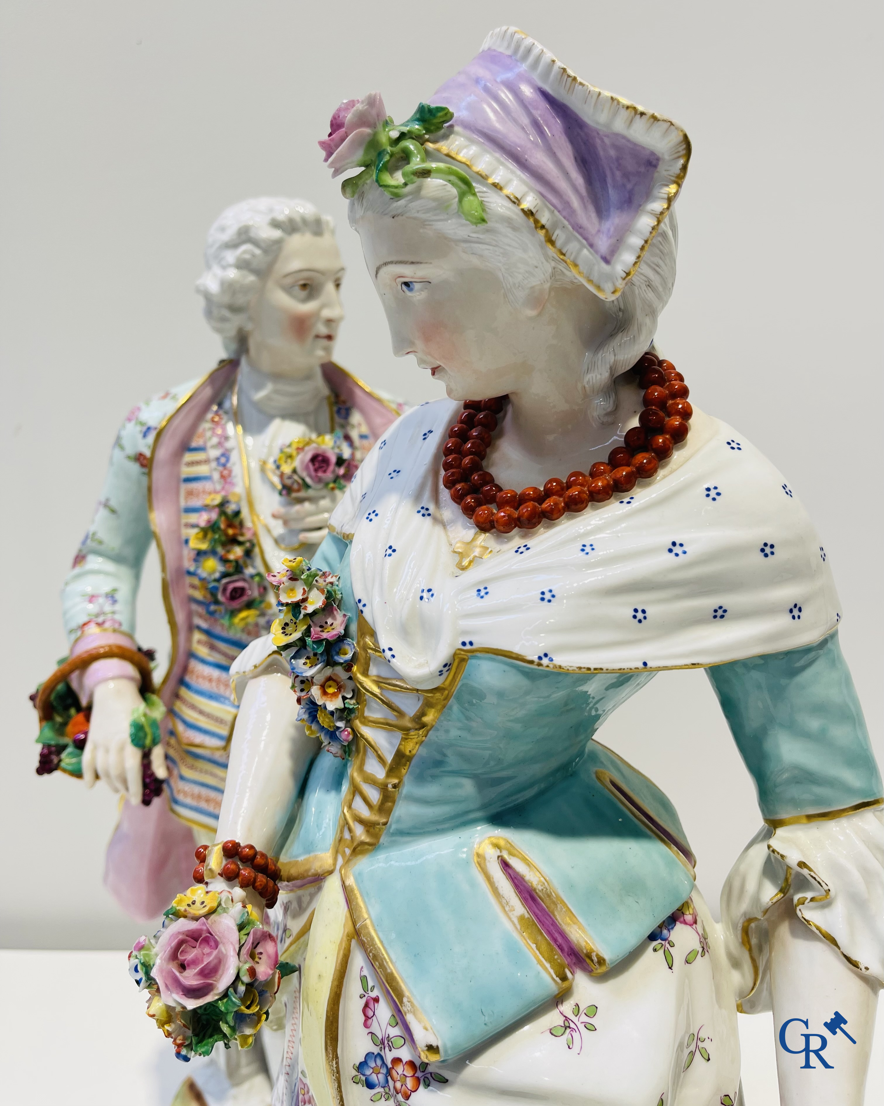 Exceptionally large pair of romantic statues in coloured and gilded porcelain in the manner of Meissen.