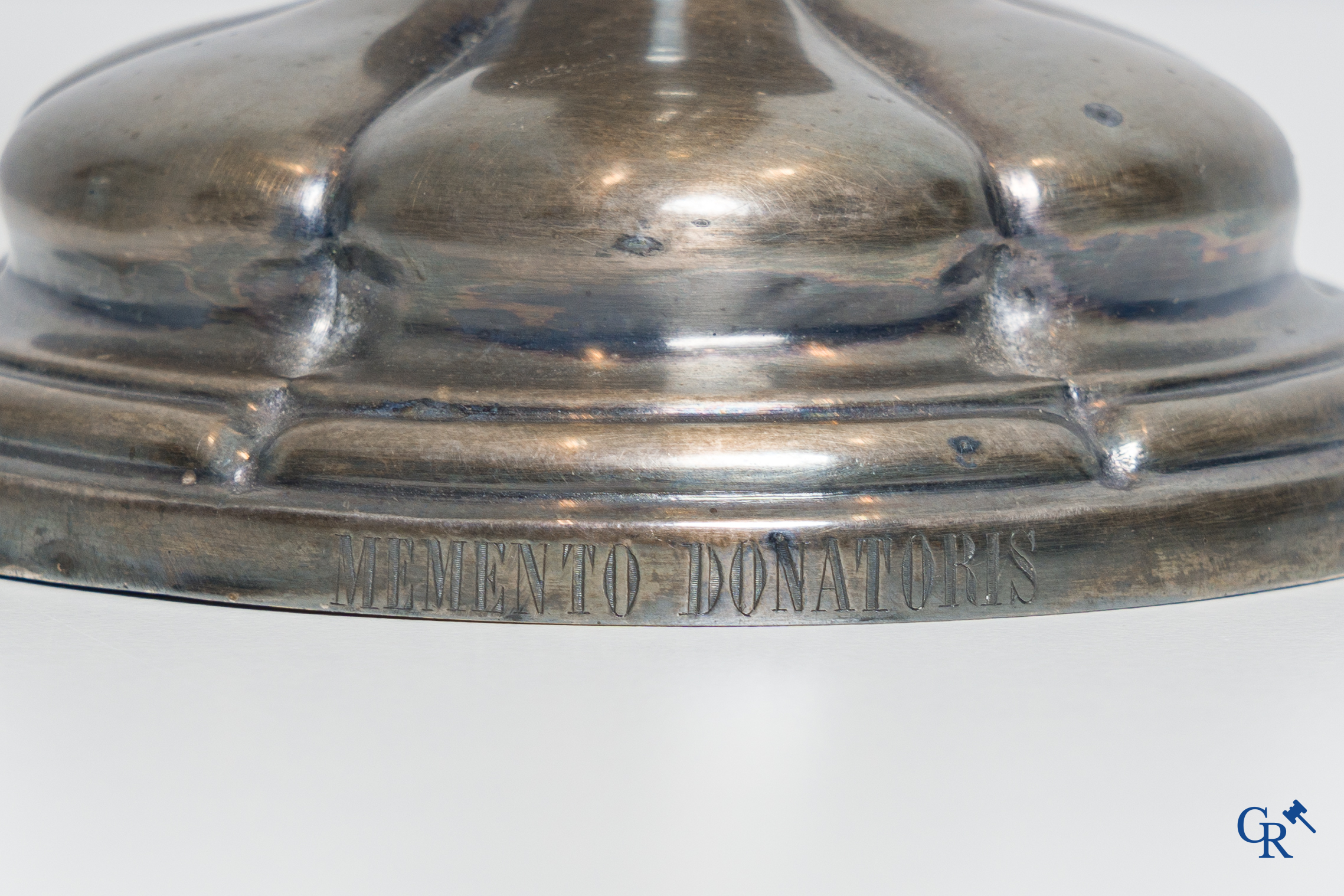 Religious objects. A silver- and gold plated chalice with Memento Donatoris inscriptions.