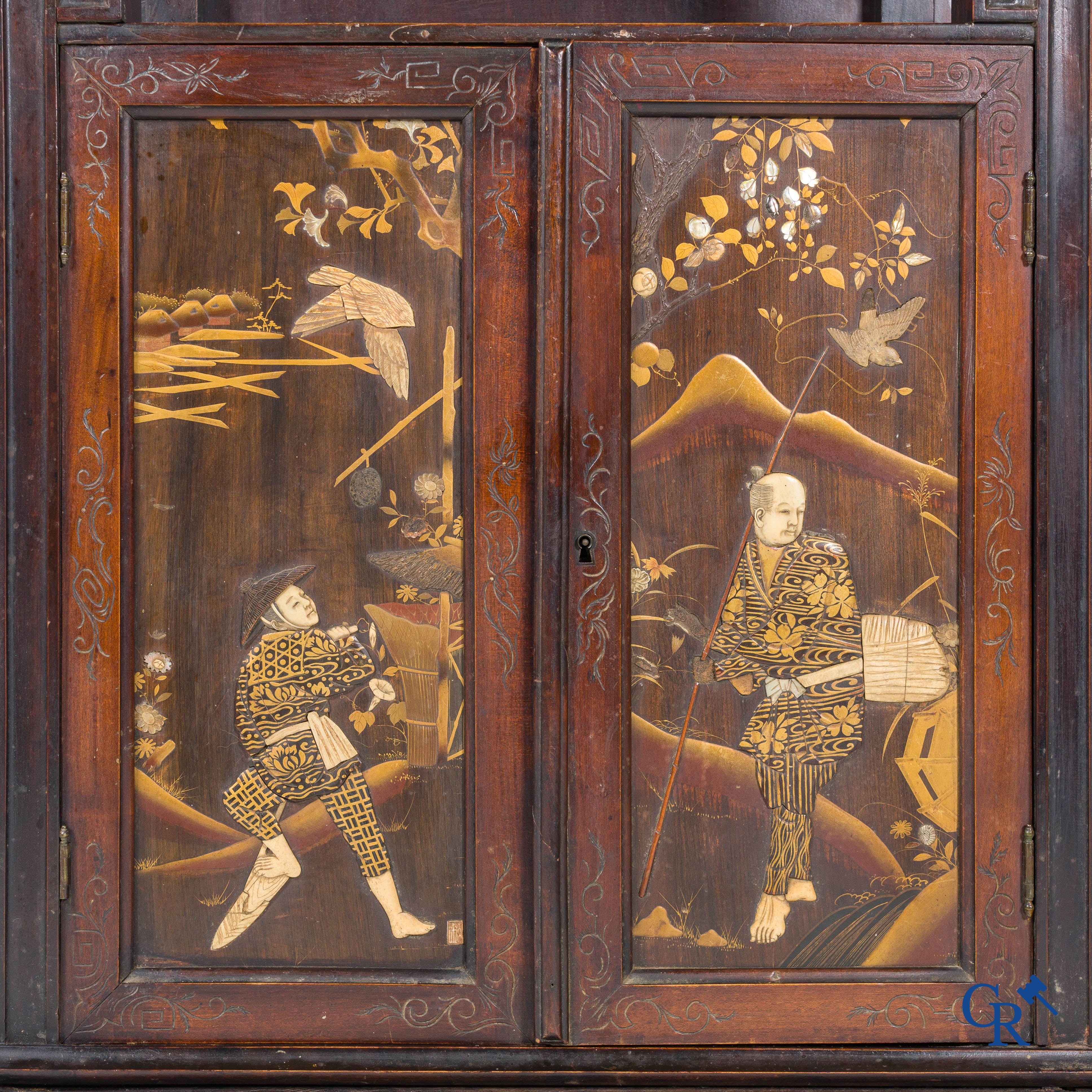 In the manner of Gabriel Viardot, a Japanese style piece of furniture with inlays and Japanese lacquer panels. Late 19th century.