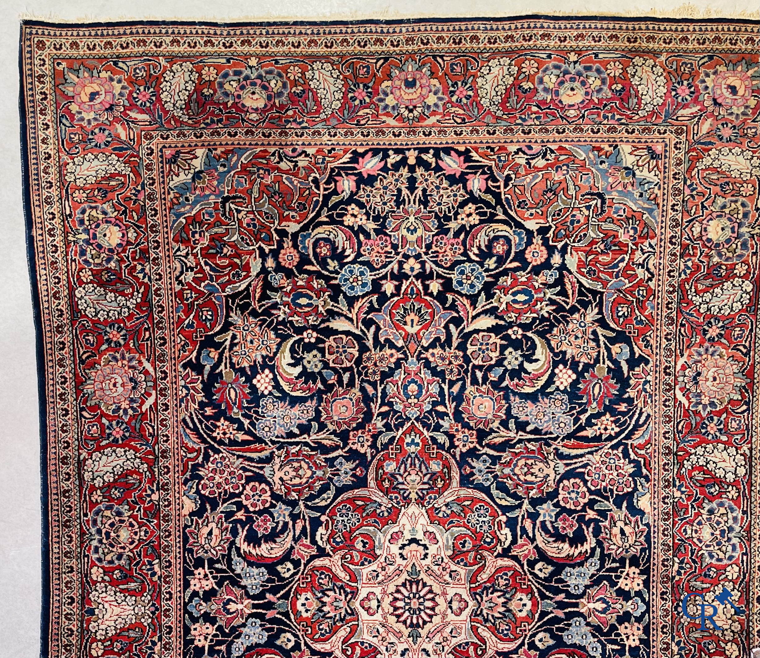 Oriental carpets: Iran. 2 antique hand-knotted Persian carpets with floral decor.