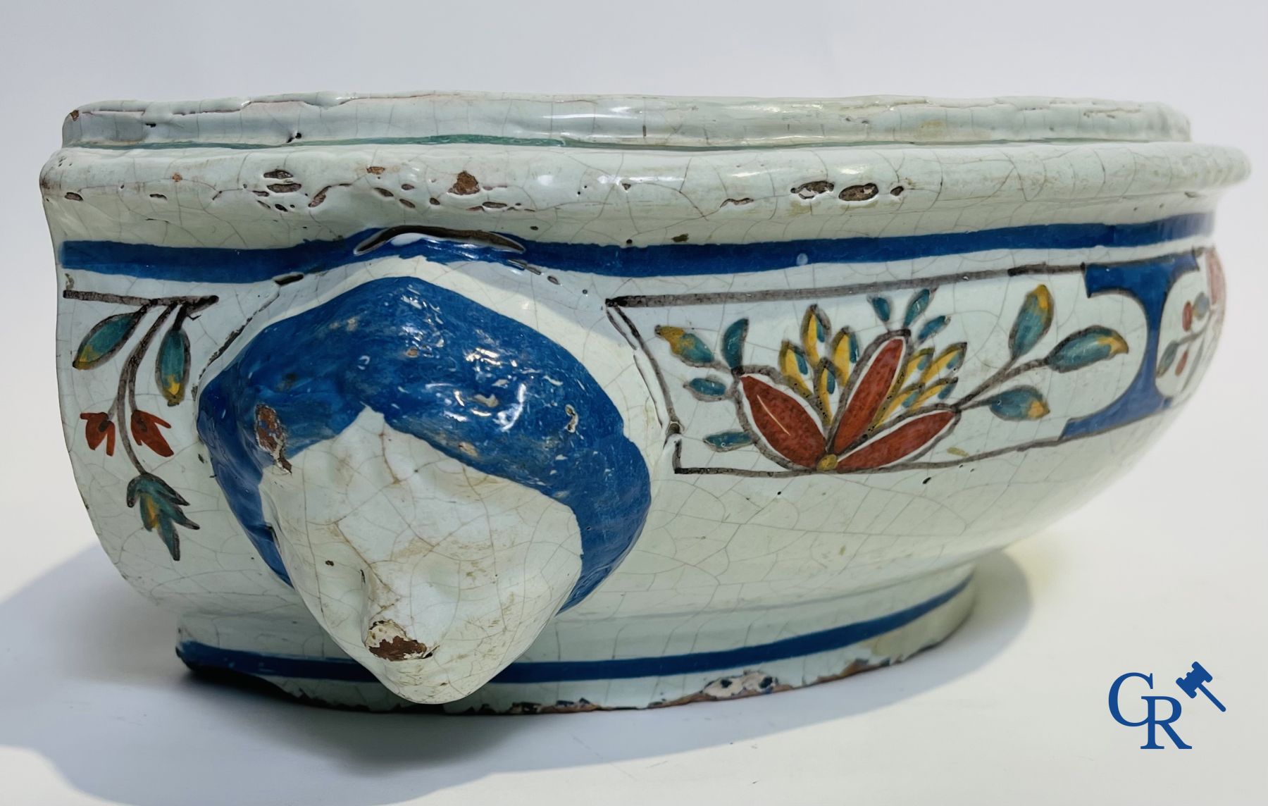 A part of a North French fountain and various pieces in faience and various antiques.