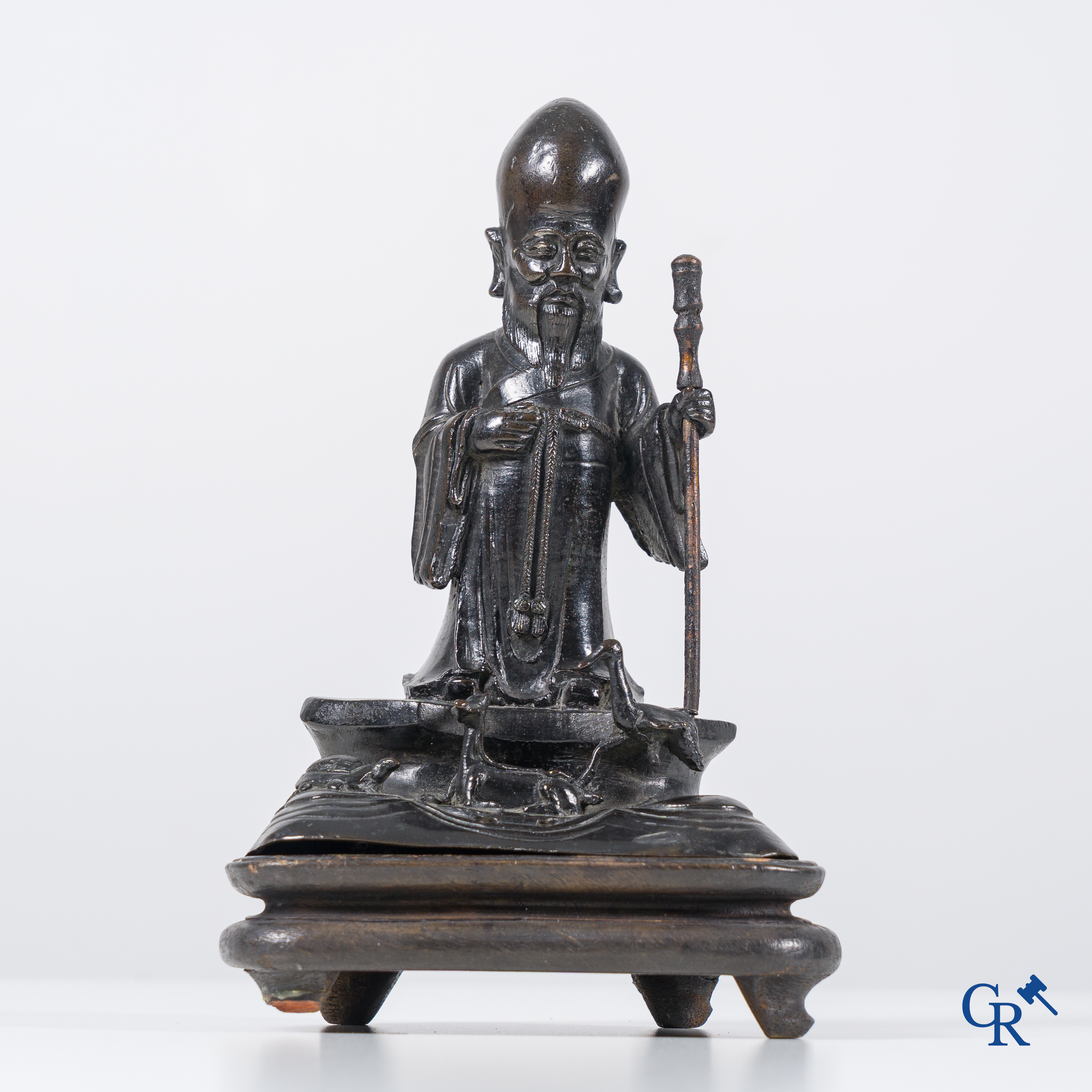 Asian Art, a Chinese bronze figure of a standing Shou Lao. Qing Dynasty.