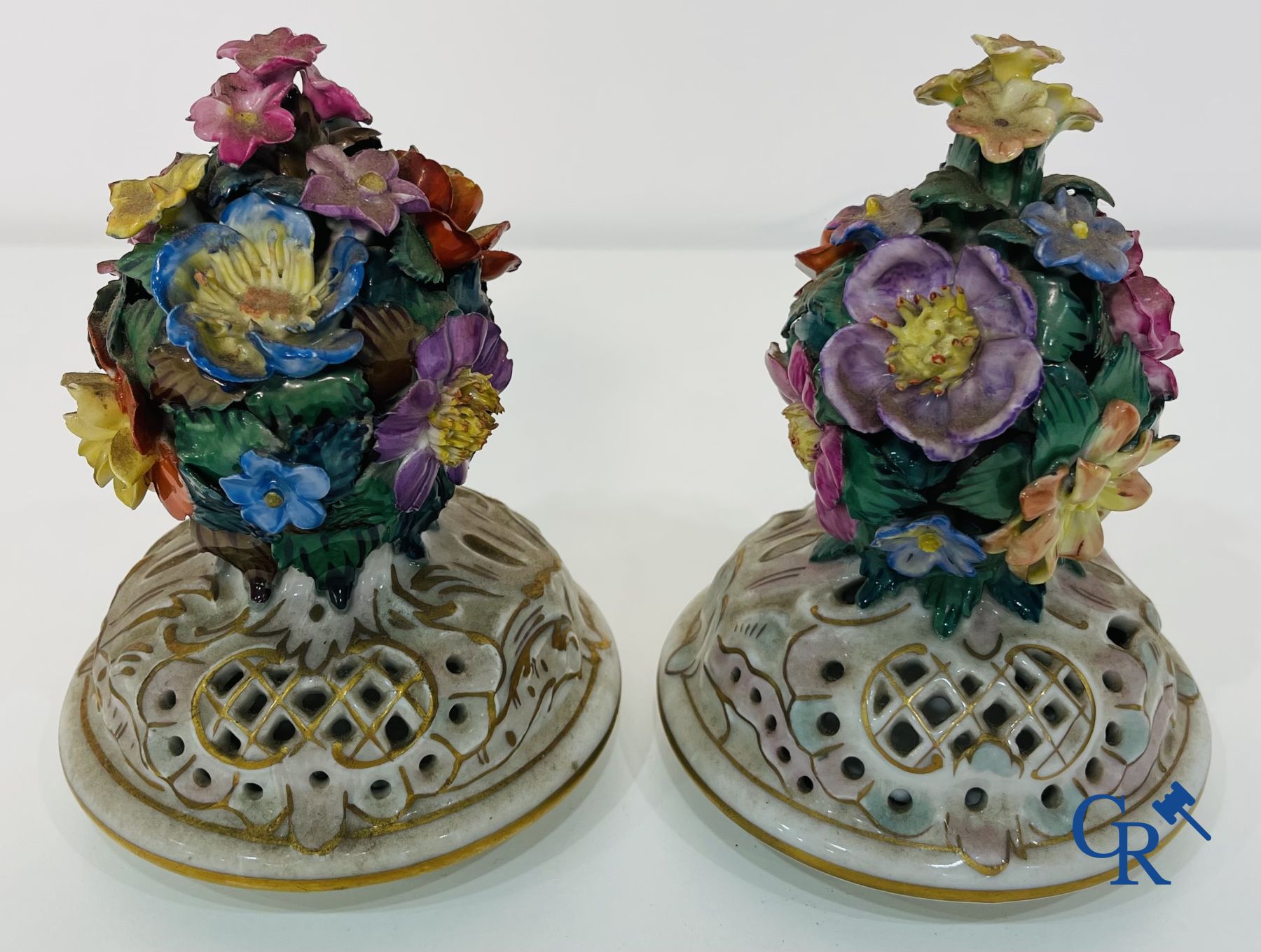 Dresden: A pair of openwork porcelain lid vases.