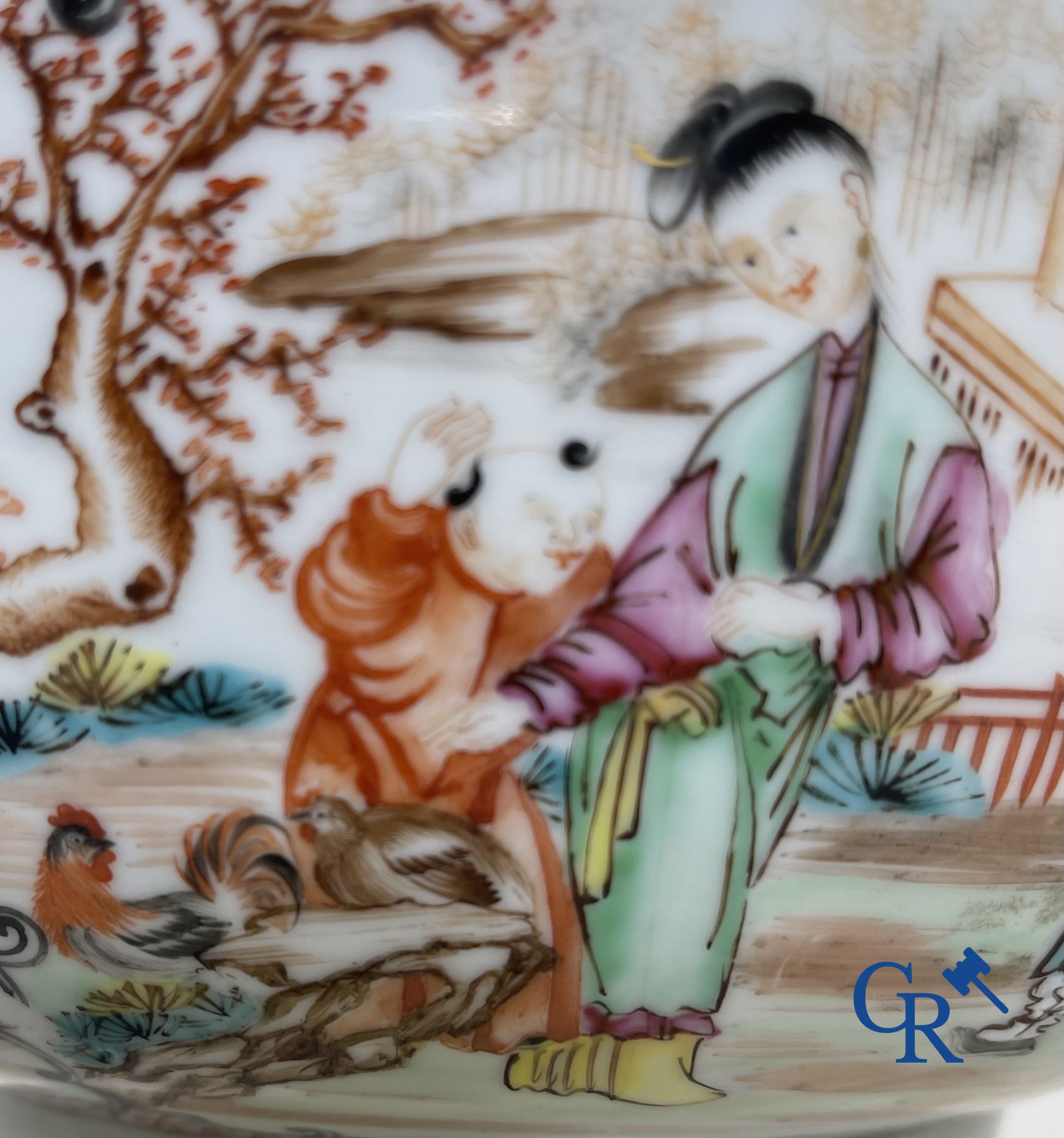 Un grand bol chinois decor mandarin en famille rose, une tasse et soucoupe en famille rose et une figurine en blanc de chine.