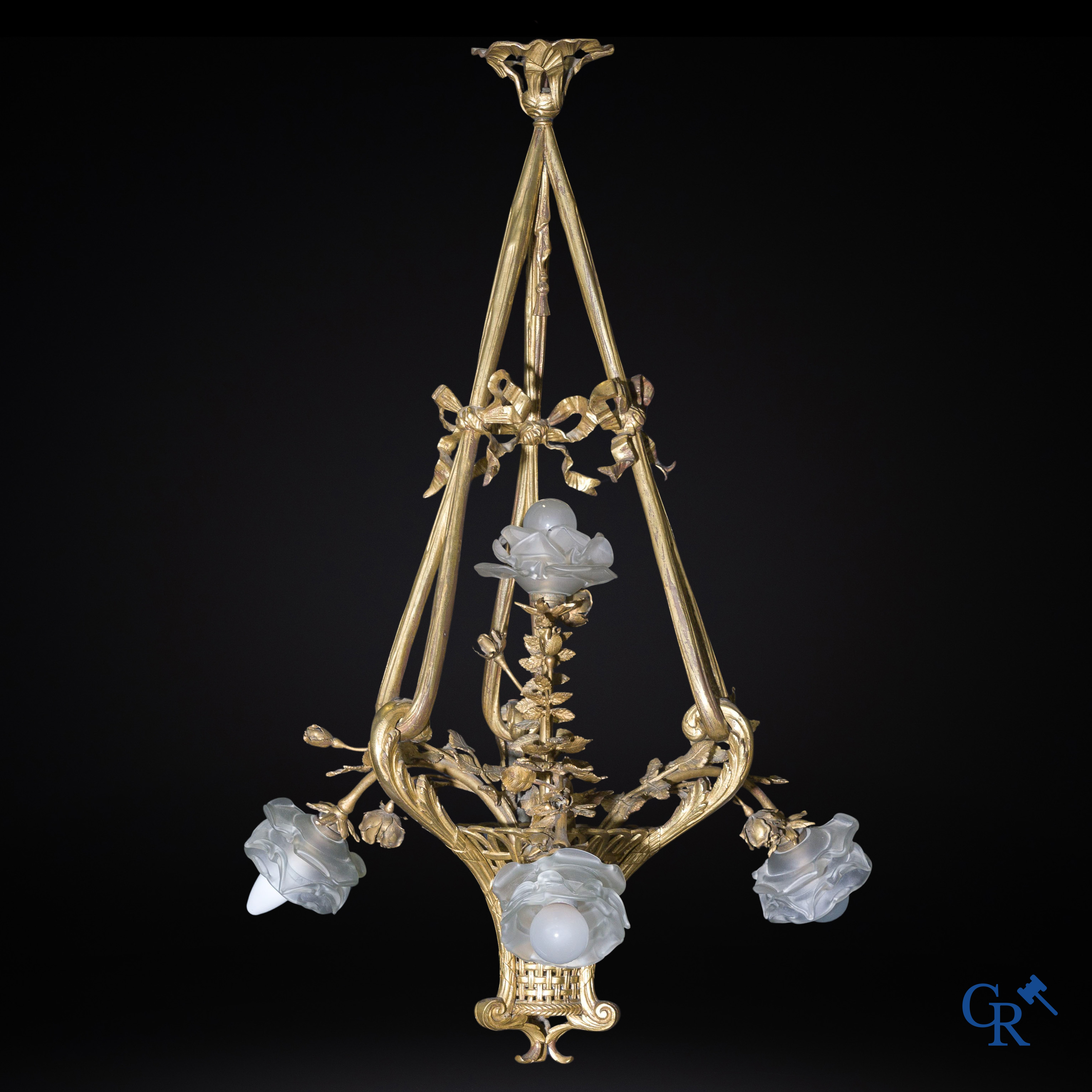 A bronze chandelier in the shape of a flower basket. LXVI style. Circa 1920.