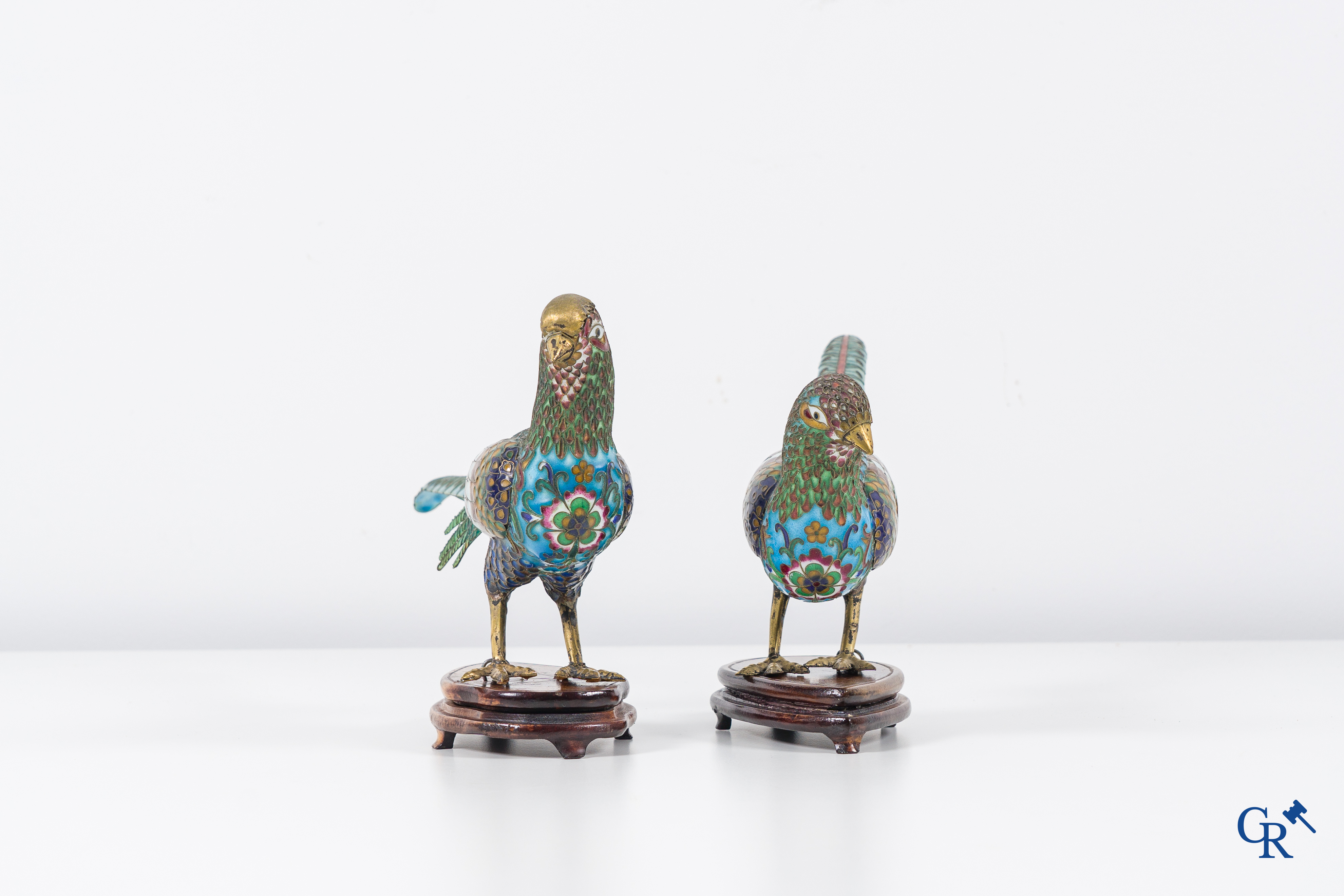 Asian Art: Chinese cloisonné. A pair of pheasants in finely crafted cloisonné. 20th century.