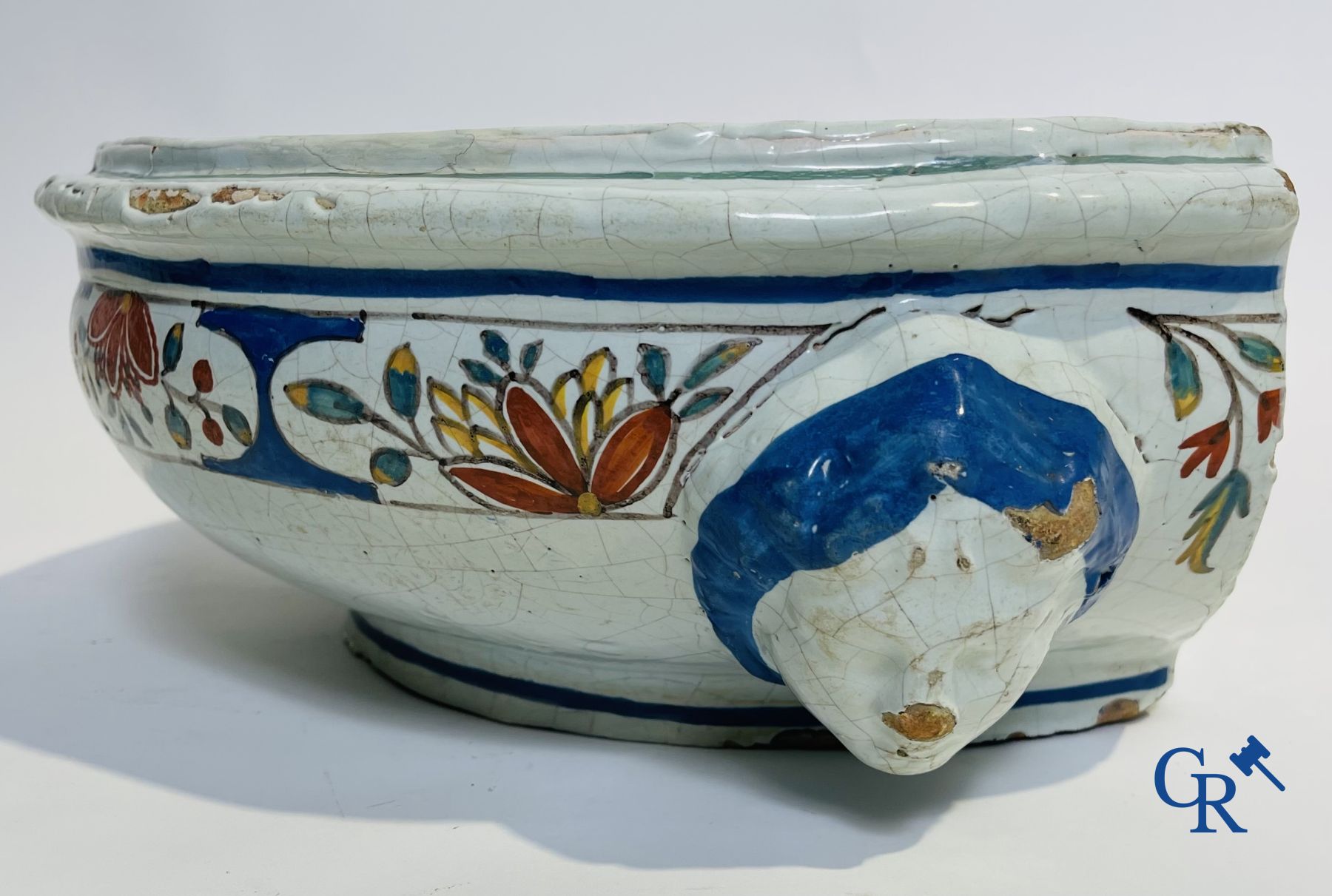 A part of a North French fountain and various pieces in faience and various antiques.