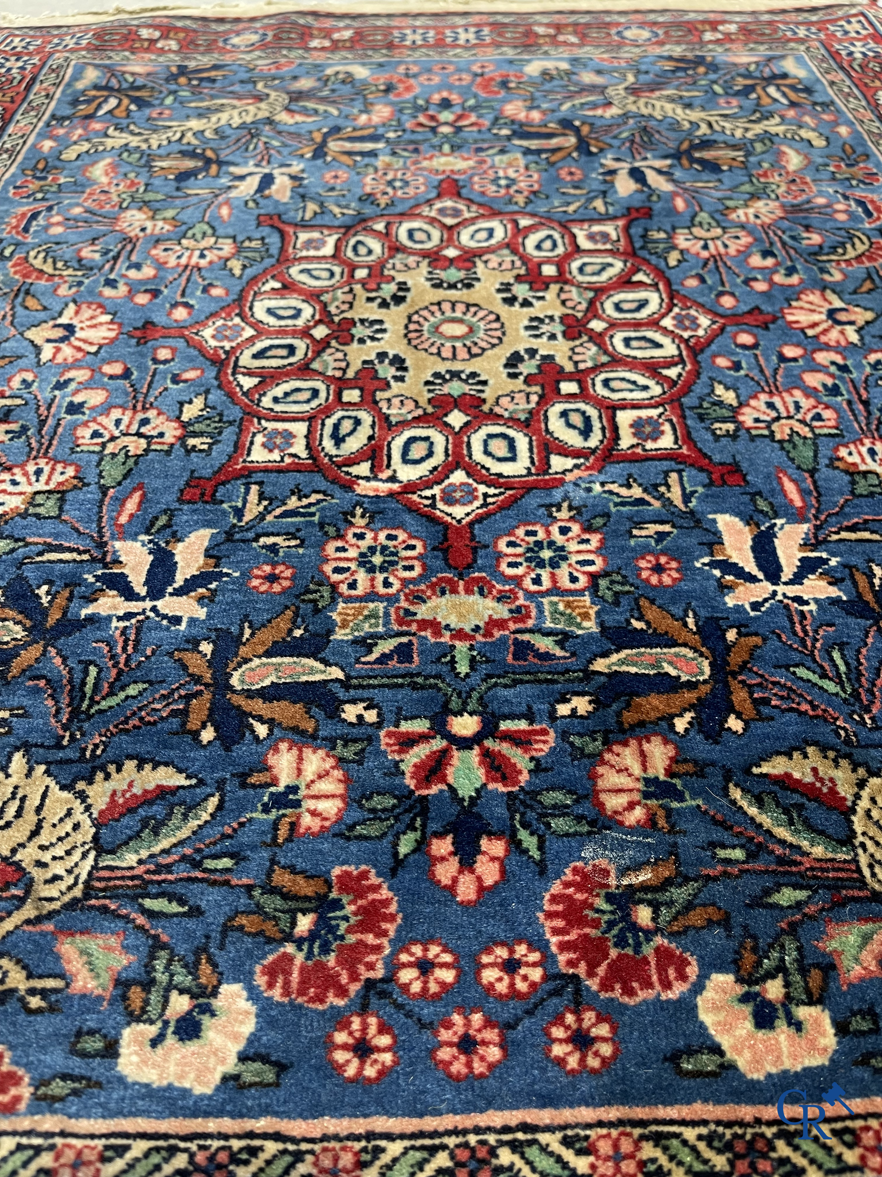 Persian carpets: A lot of 2 finely knotted Oriental carpets. Floral decor and floral decor with birds of paradise.