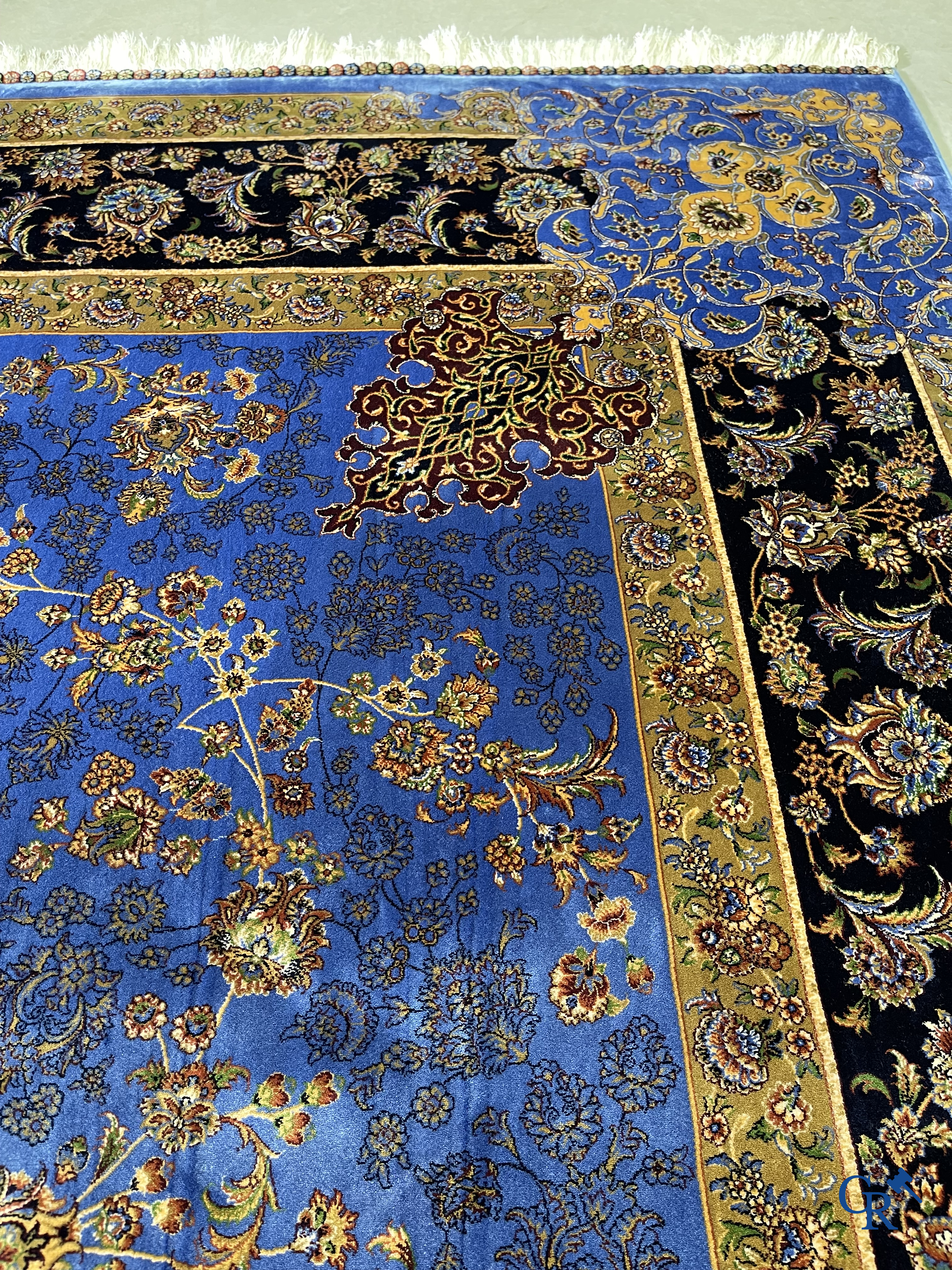 Carpets. Exceptional silk carpet with floral decor on a blue background.